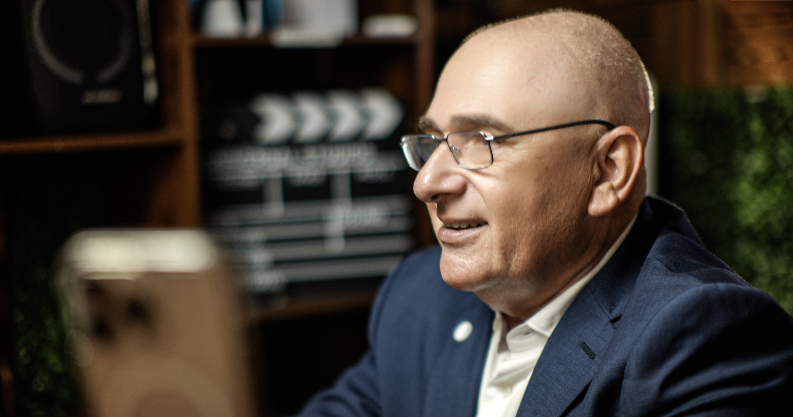 Close-up business interview at ProStudio1 in Hollywood, FL — speaker on camera with cinematic lighting for podcast and brand videos.