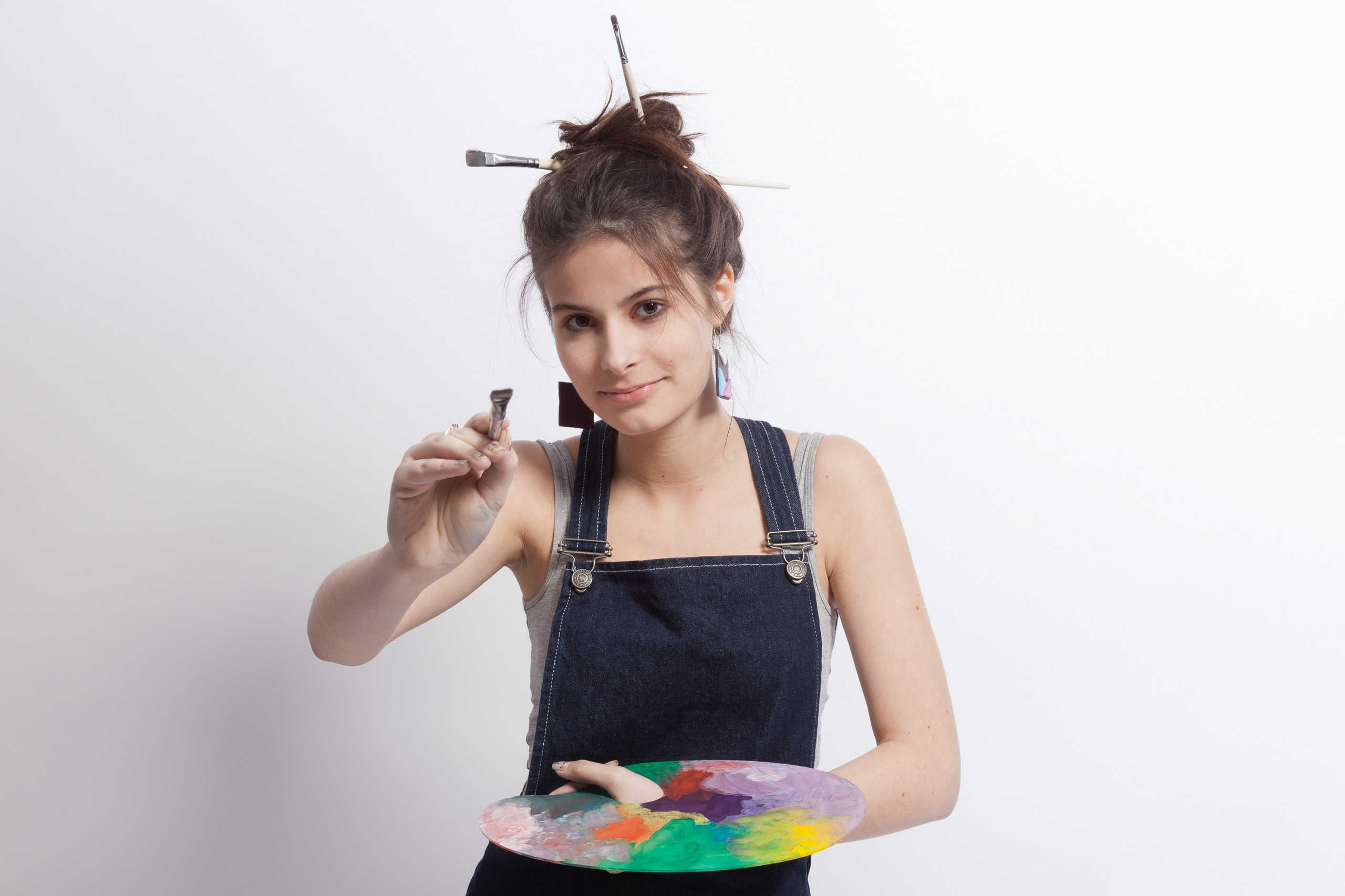 Portrait of a young artist girl on white studio background - photographer Andrey Dunin