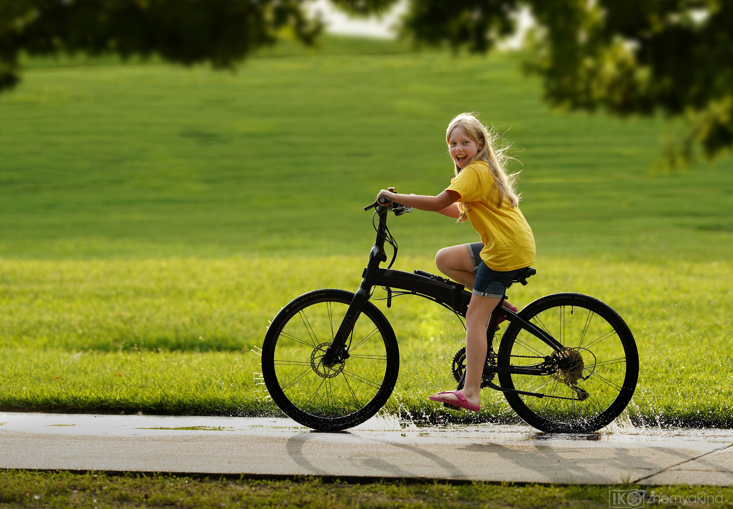 Children-in-a-puddle. Photographer Irina Kozhemyakina. Houston