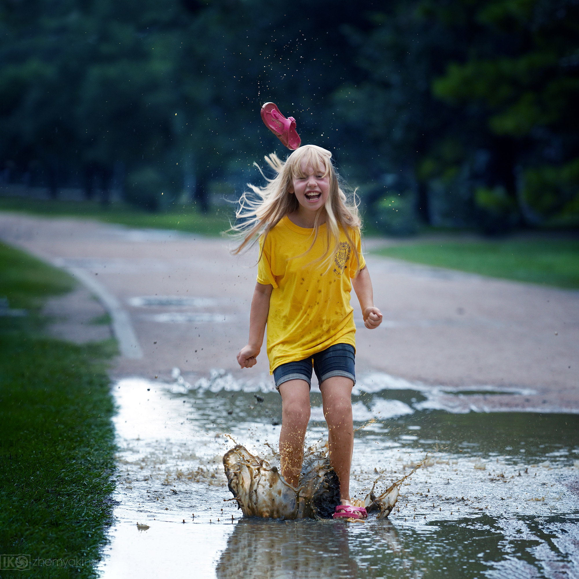Children-in-a-puddle. Photographer Irina Kozhemyakina. Houston