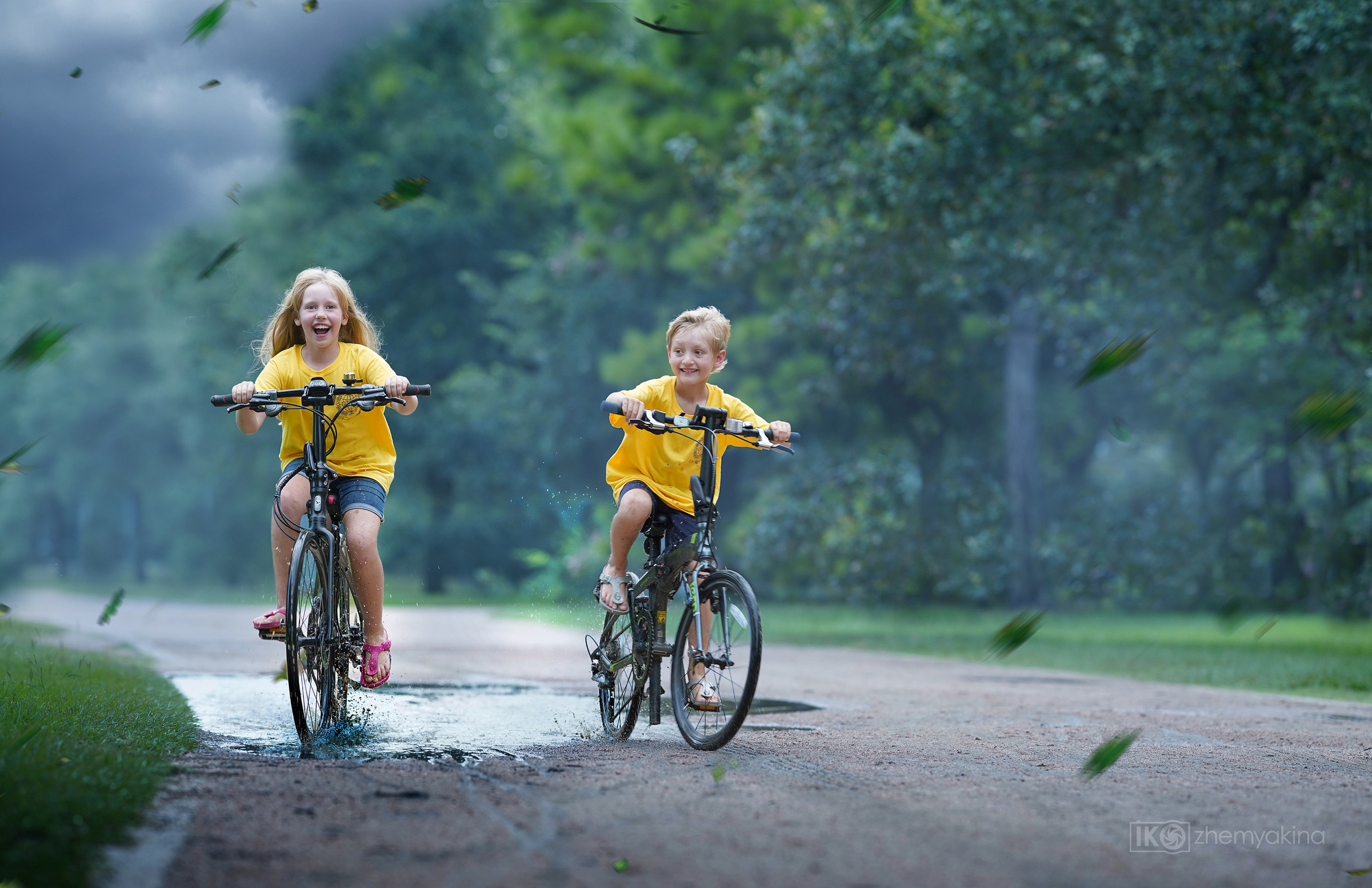 Children-in-a-puddle. Photographer Irina Kozhemyakina. Houston