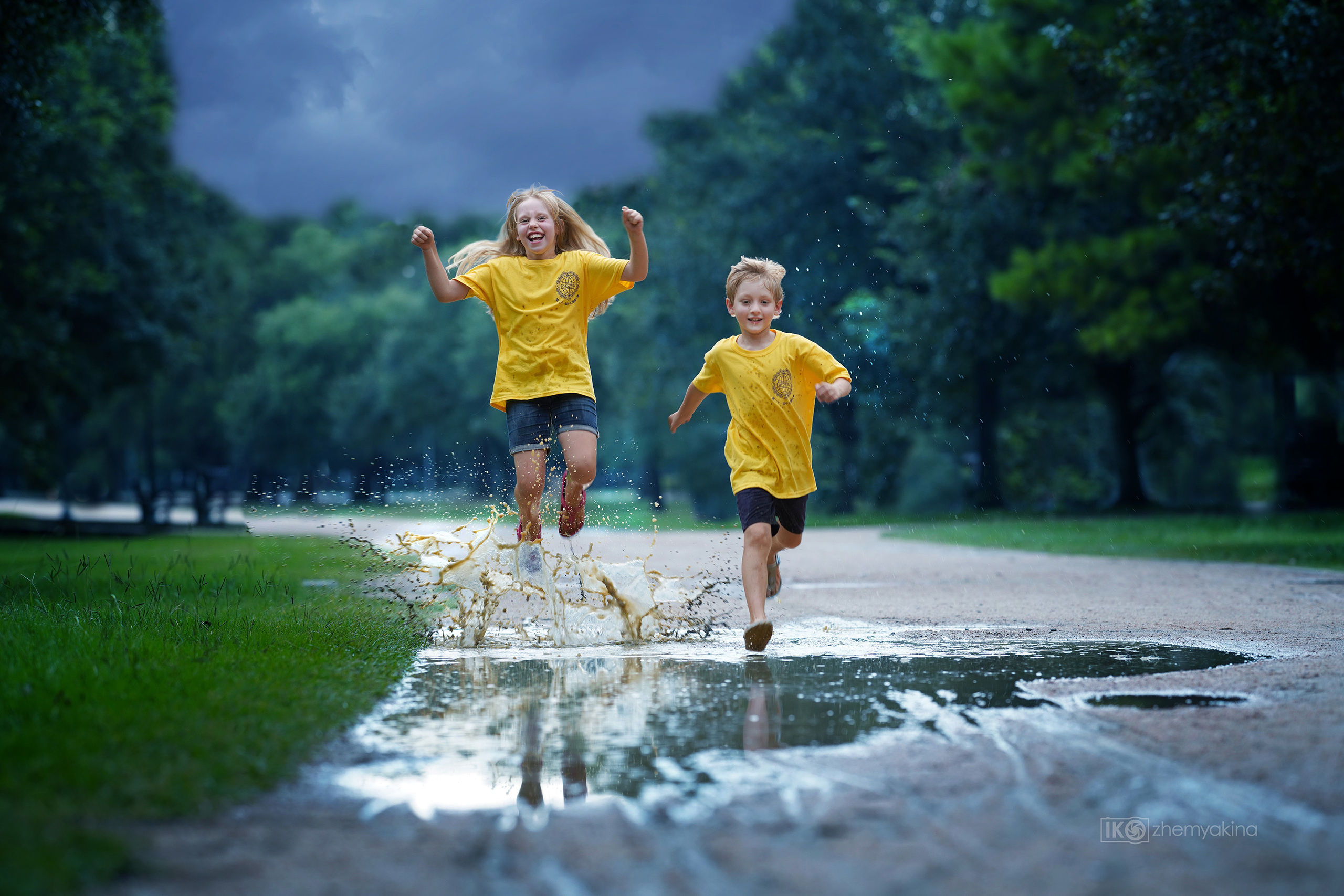 Children-in-a-puddle. Photographer Irina Kozhemyakina. Houston
