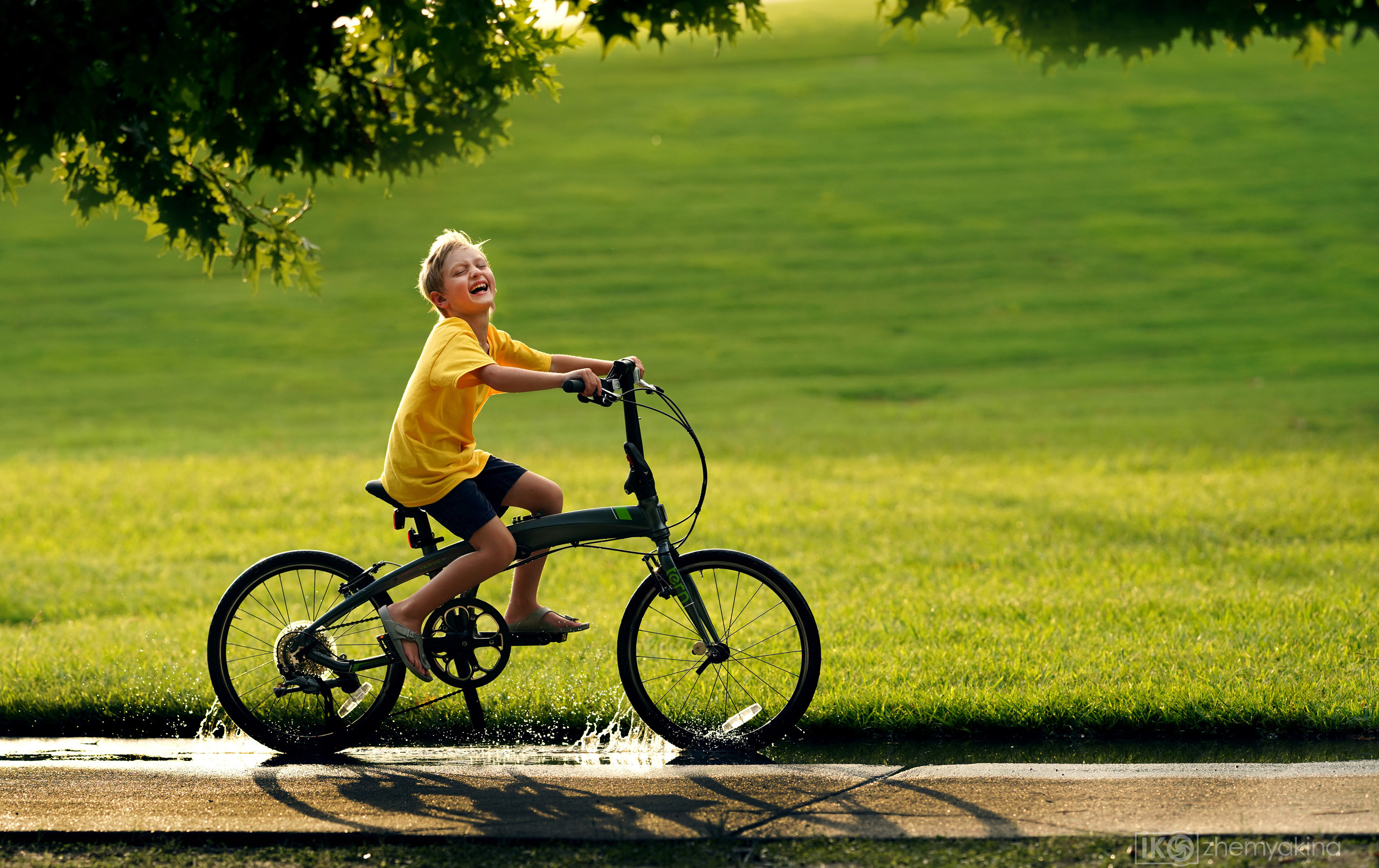 Children-in-a-puddle. Photographer Irina Kozhemyakina. Houston