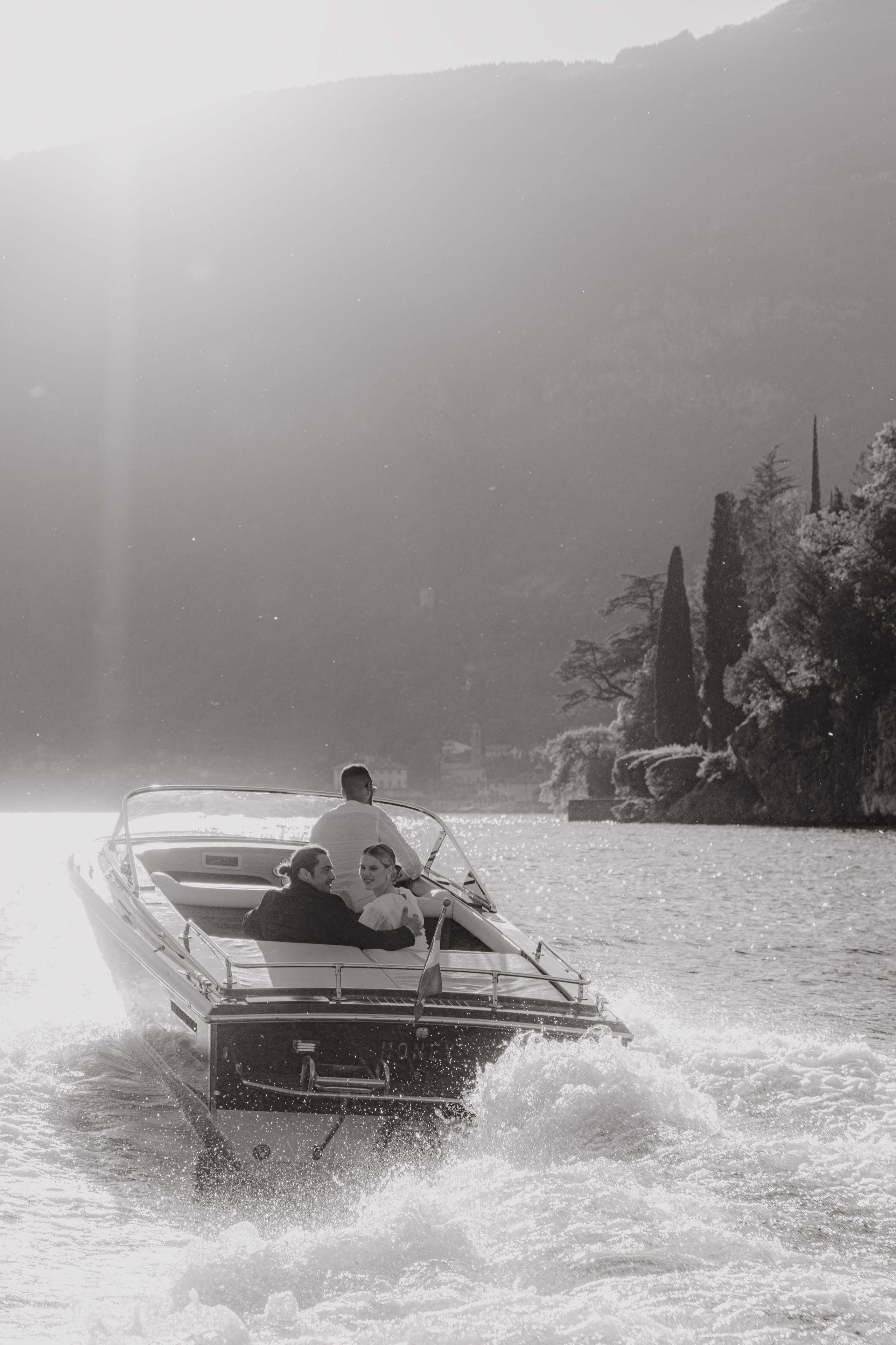     Lake Como sunset elopement with mountains and calm water