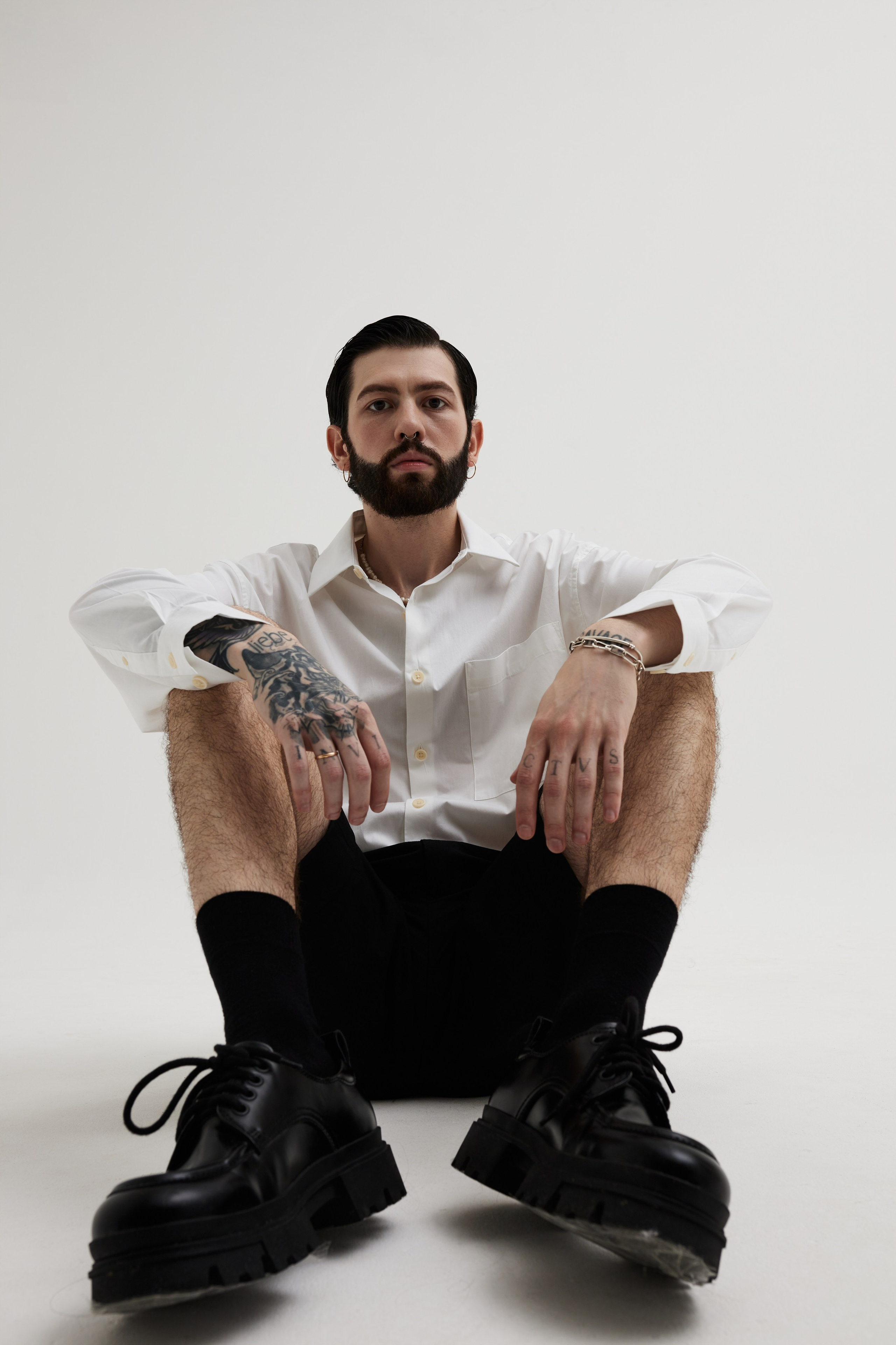 Men’s Studio Portrait: A Minimalist Style Against a White Background. Photographer & videographer in Tbilisi, Georgia
