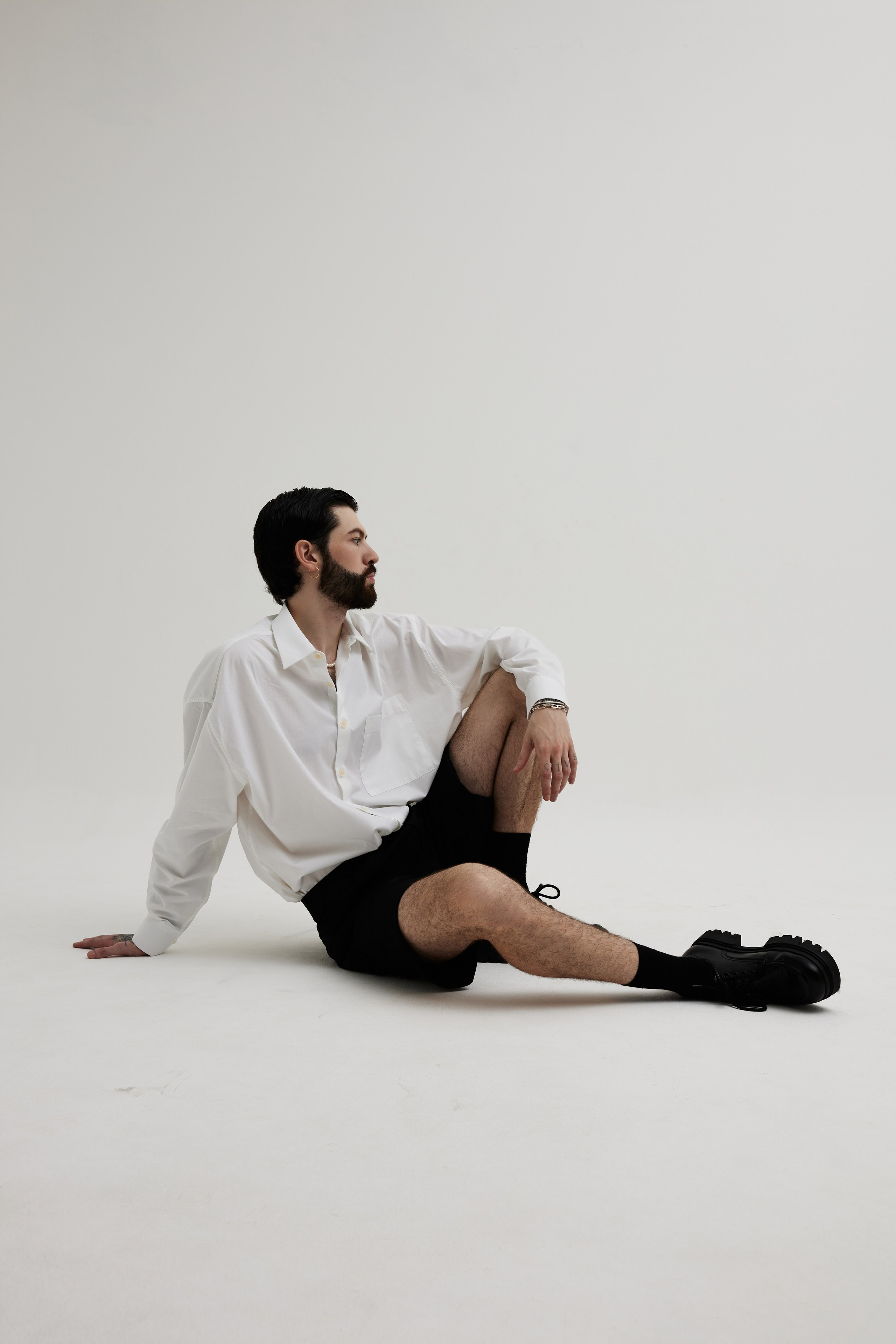 Men’s Studio Portrait: A Minimalist Style Against a White Background. Photographer & videographer in Tbilisi, Georgia