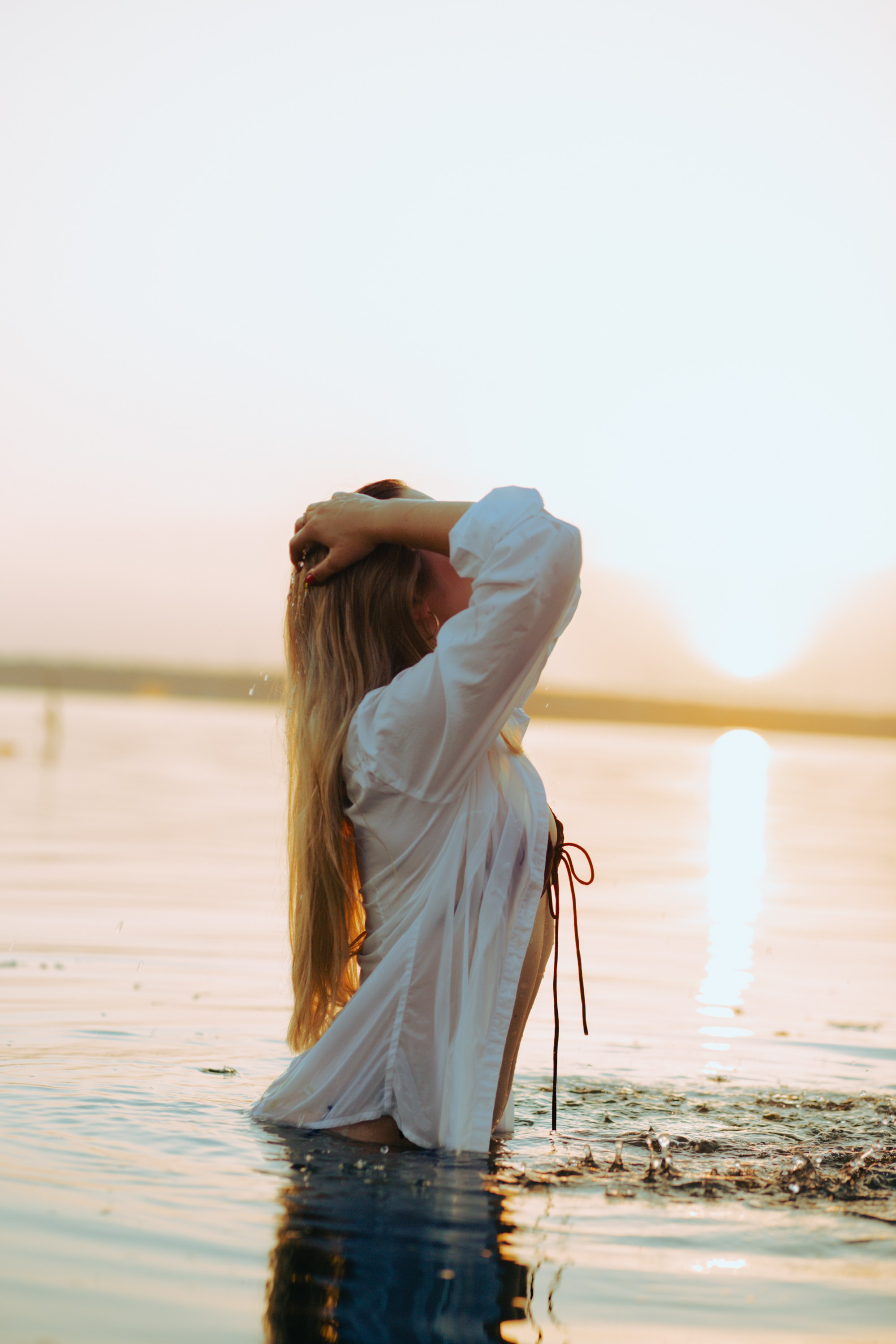 A photoshoot with Yulia in a boat on the water. Photographer & videographer in Tbilisi, Georgia