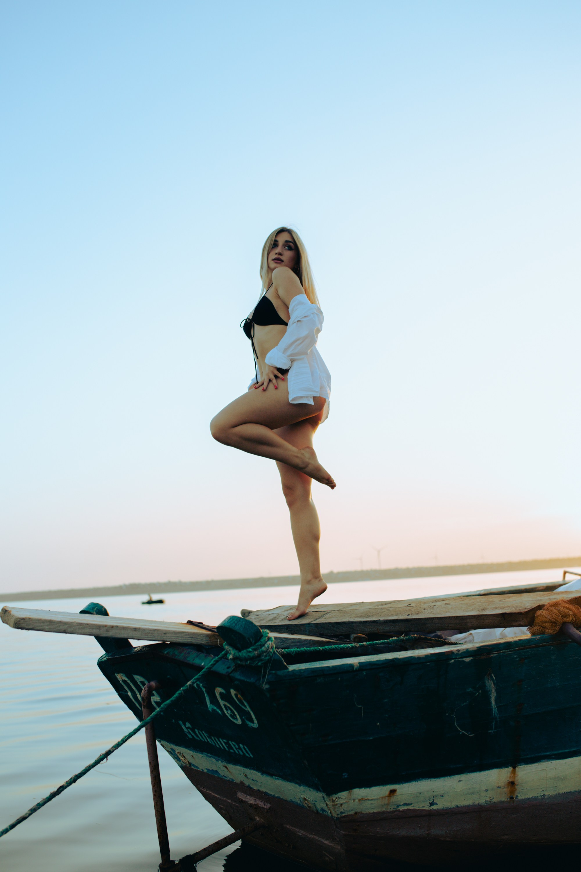 A photoshoot with Yulia in a boat on the water. Photographer & videographer in Tbilisi, Georgia