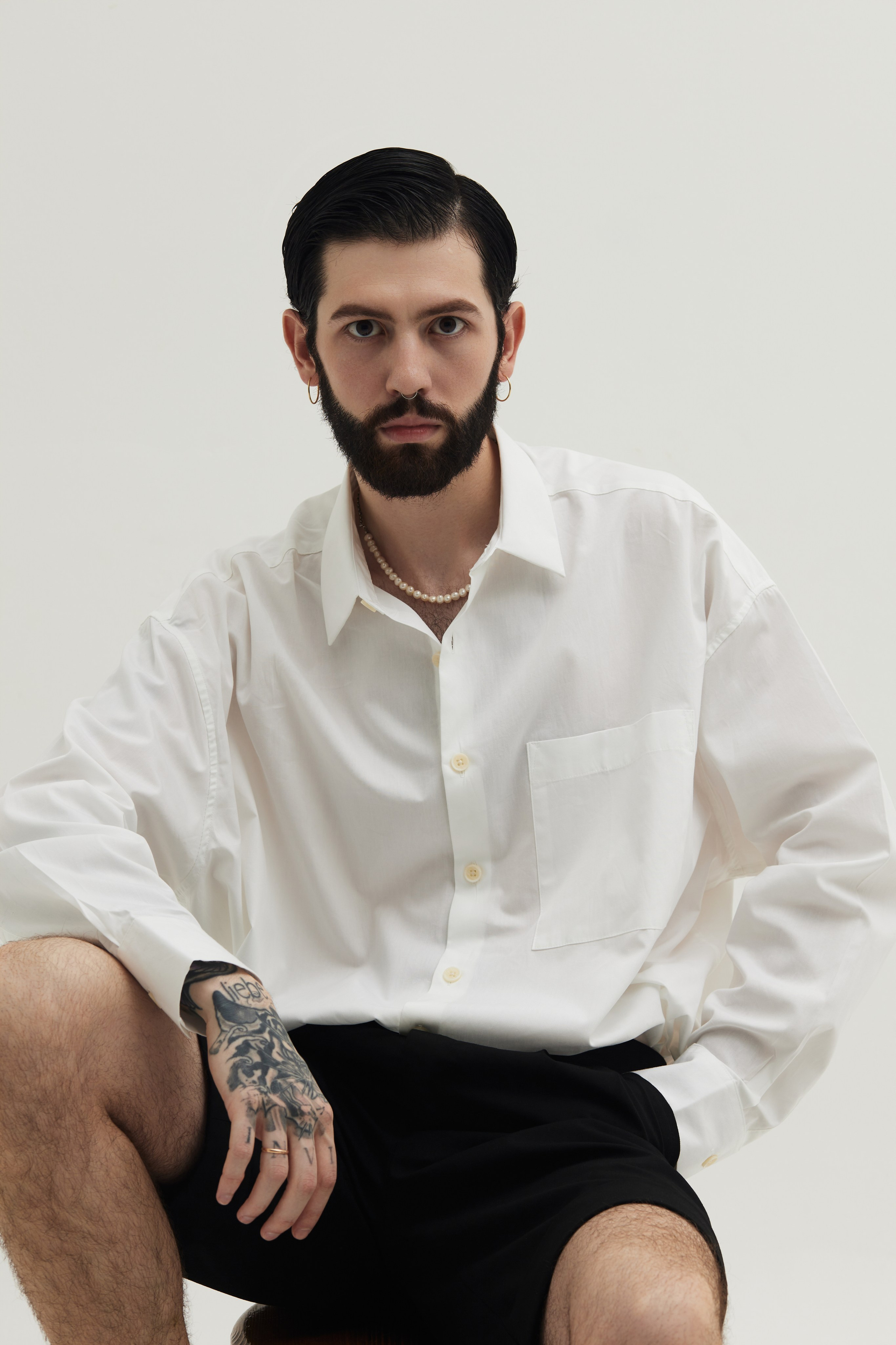 Men’s Studio Portrait: A Minimalist Style Against a White Background. Photographer & videographer in Tbilisi, Georgia