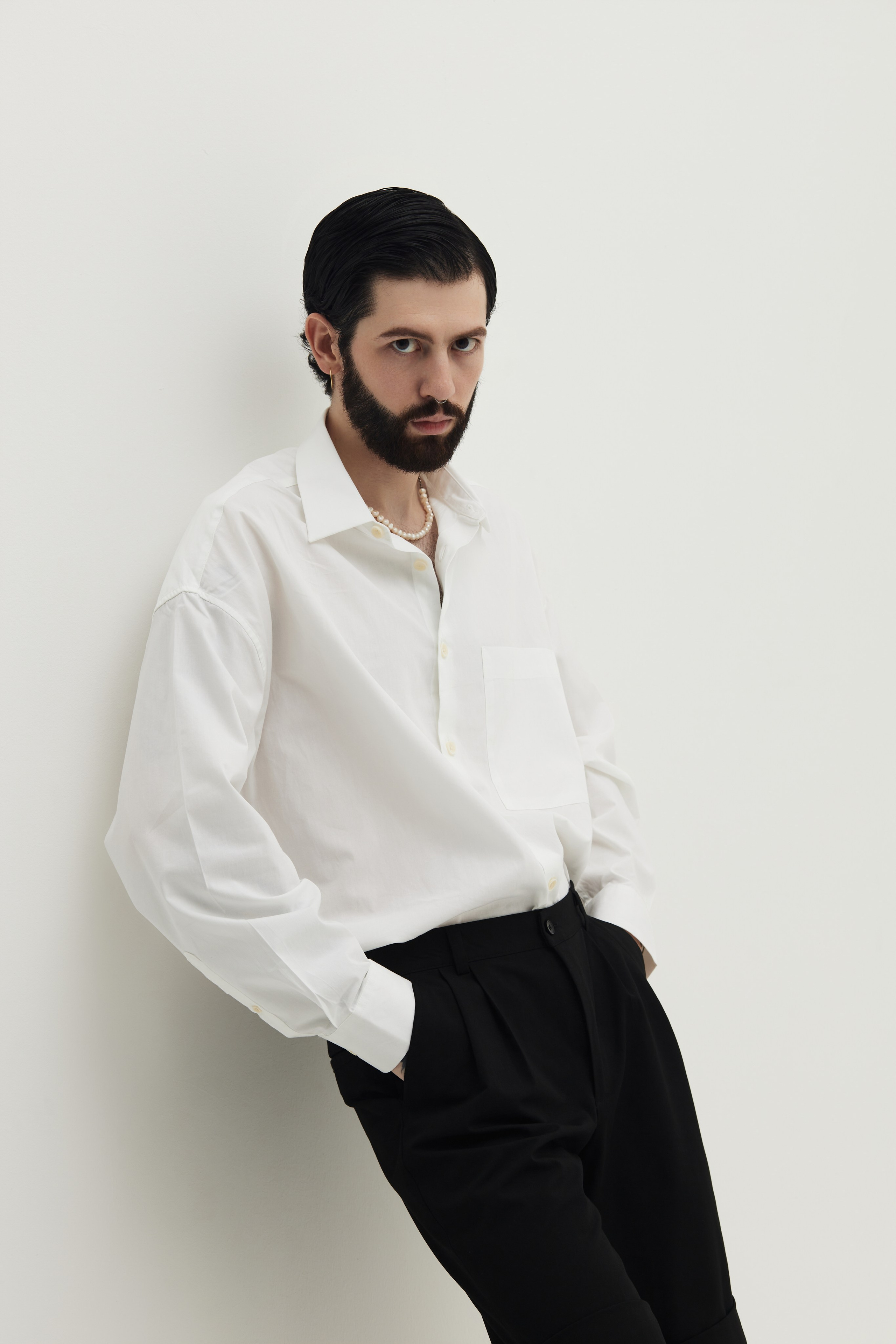Men’s Studio Portrait: A Minimalist Style Against a White Background. Photographer & videographer in Tbilisi, Georgia