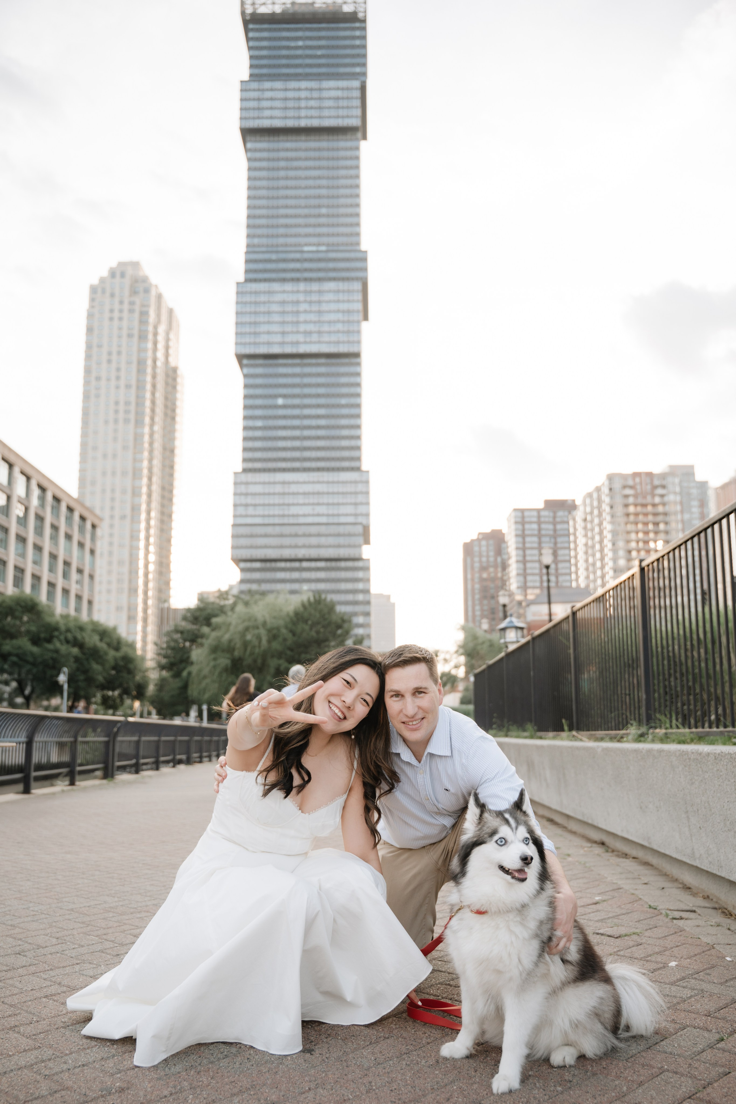 An adorable couple with their dog. Portrait and wedding photographer in New York