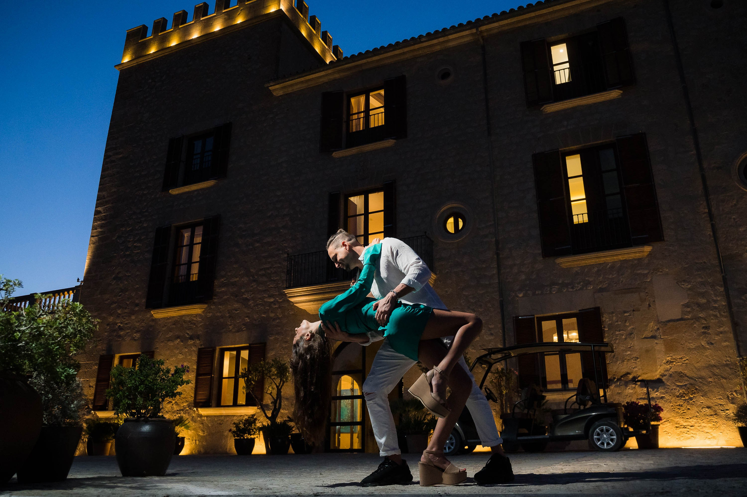 Couple in black and white dance, smile and celebrate their proposal at the Cap Rocat Venue.