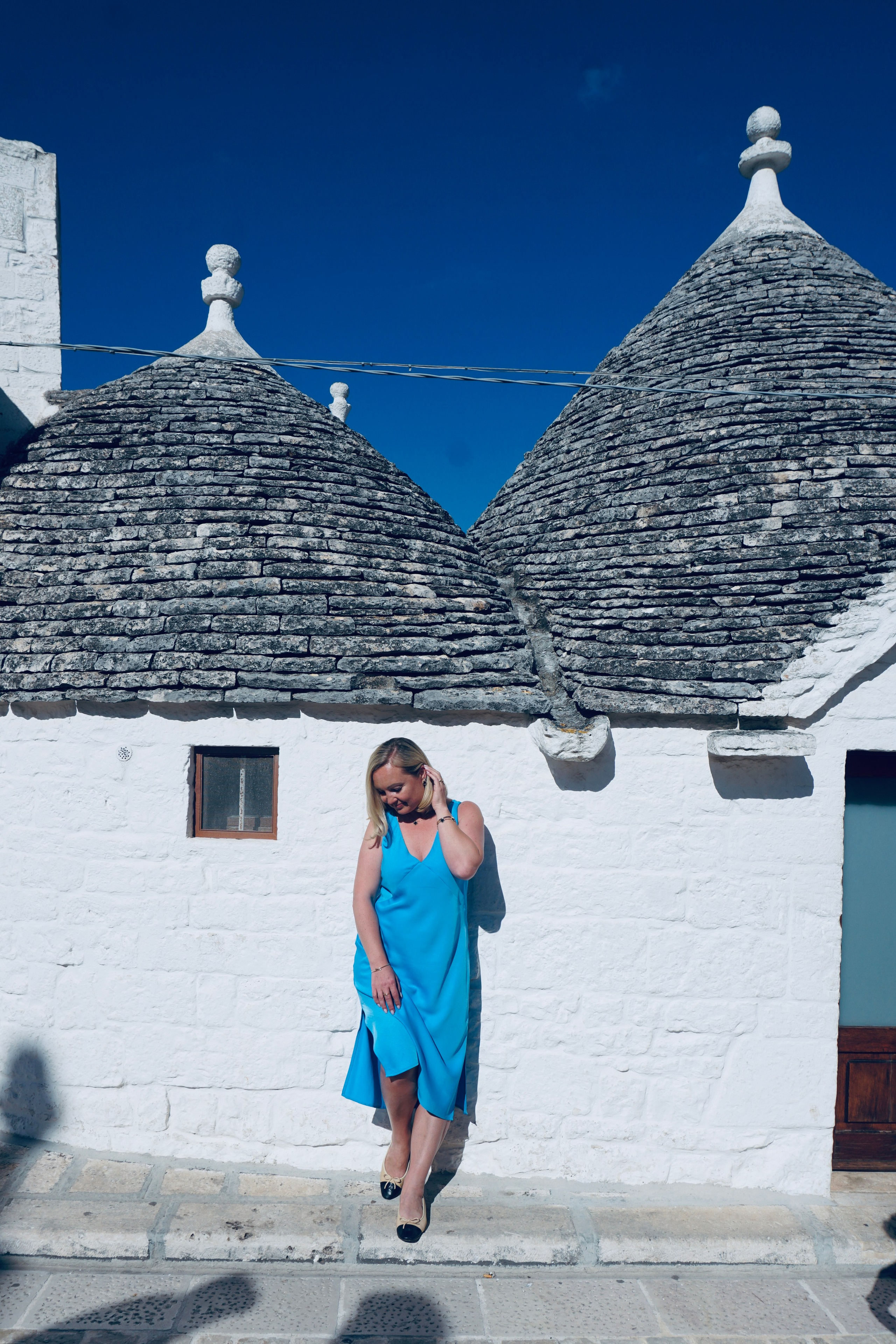 Passeggiata ad Alberobello con turisti americani felici. Fotografa e Videografa in Puglia Sokhova Albina