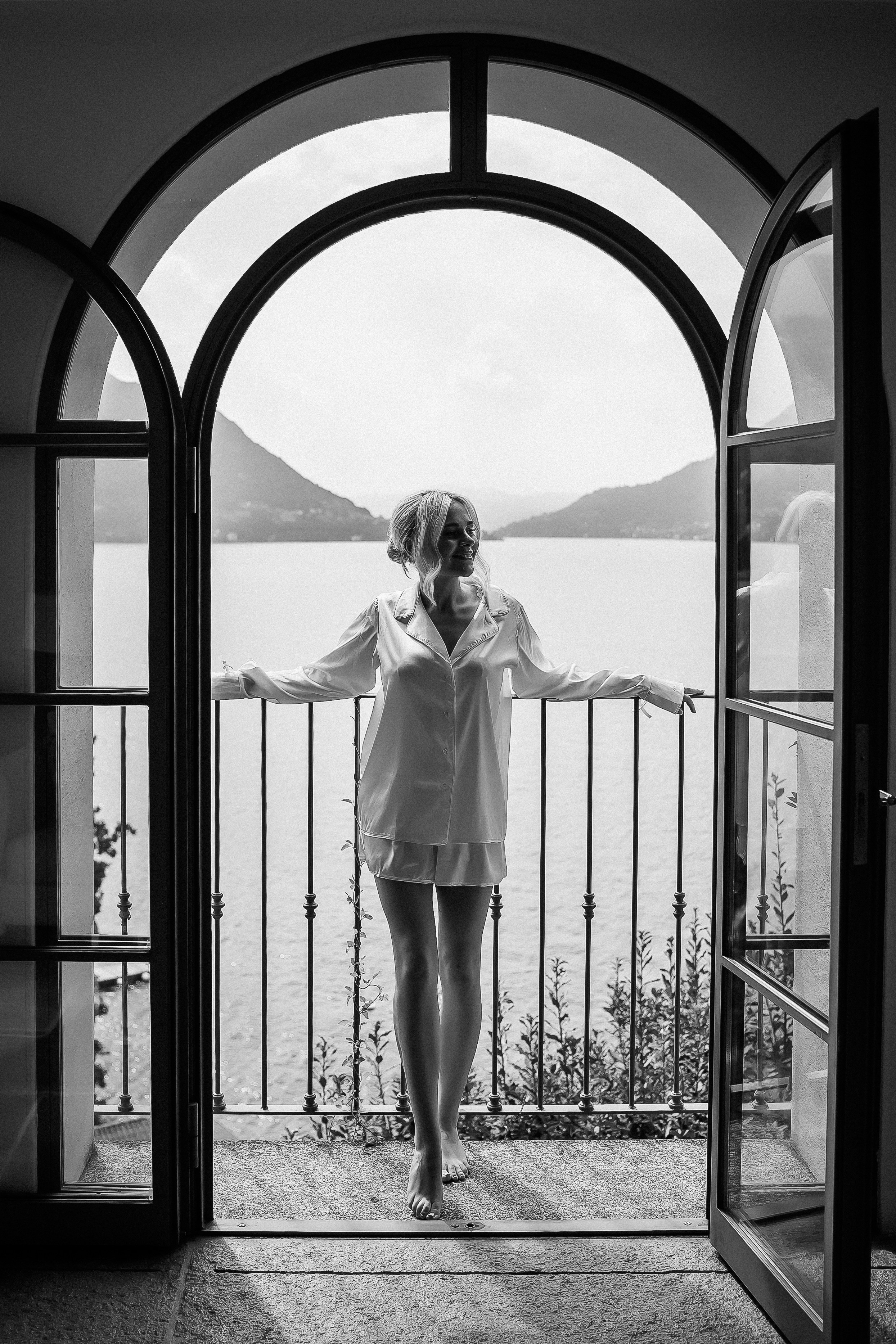Black and white portrait of a bride overlooking Lake Como from Villa Lario, Italy