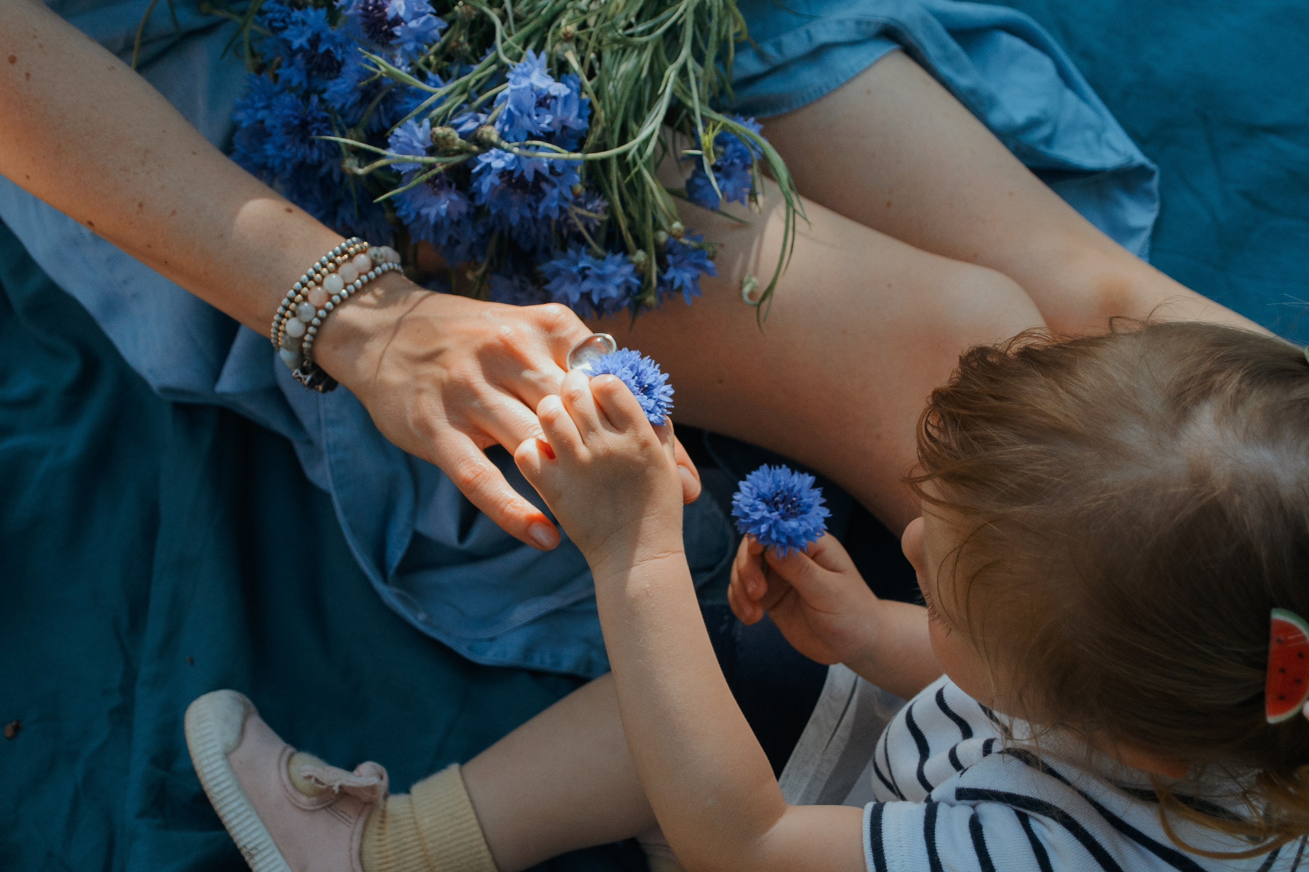 Lovely Child hugged by her mum. Family private photo session
