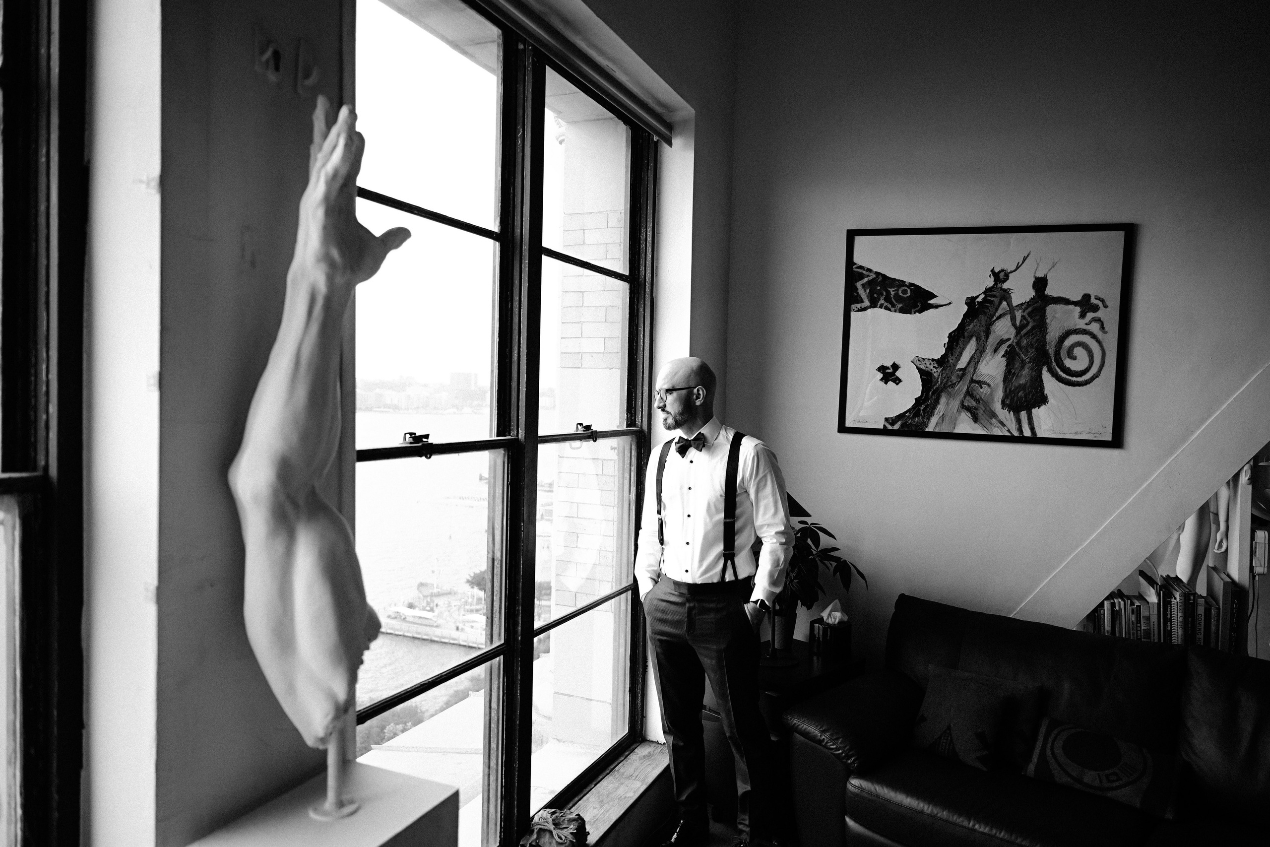 a man standing in front of a window