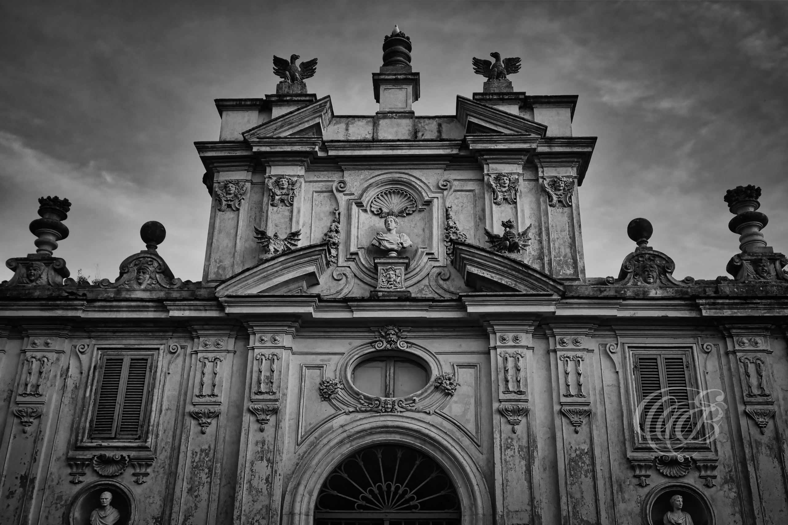 Rome Italy - Villa Borghese partial facade at sunset - B&W - Eduardo Bartoli Fine Art Photography - Black and white fine art photograph showing a portion of Villa Borghese’s facade against the sunset sky in Rome, Italy – photography by Eduardo Bartoli.