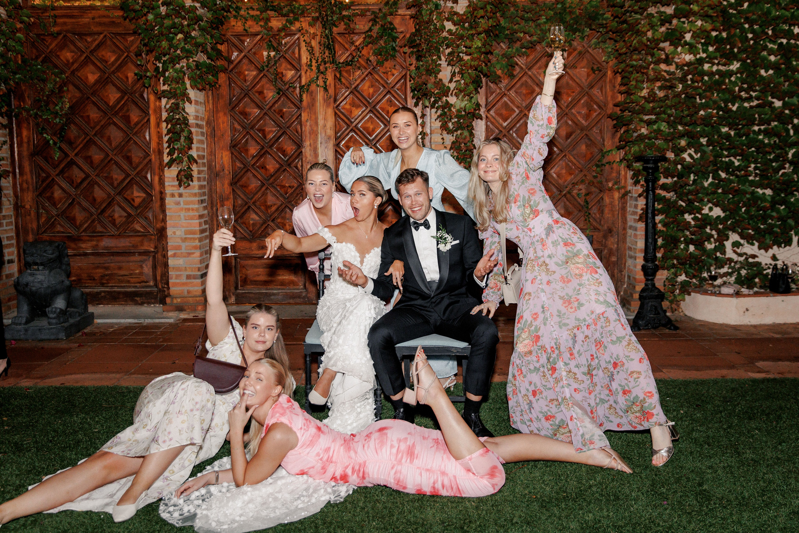 Wedding guests capture memories during a beautiful outdoor wedding party in Barcelona.