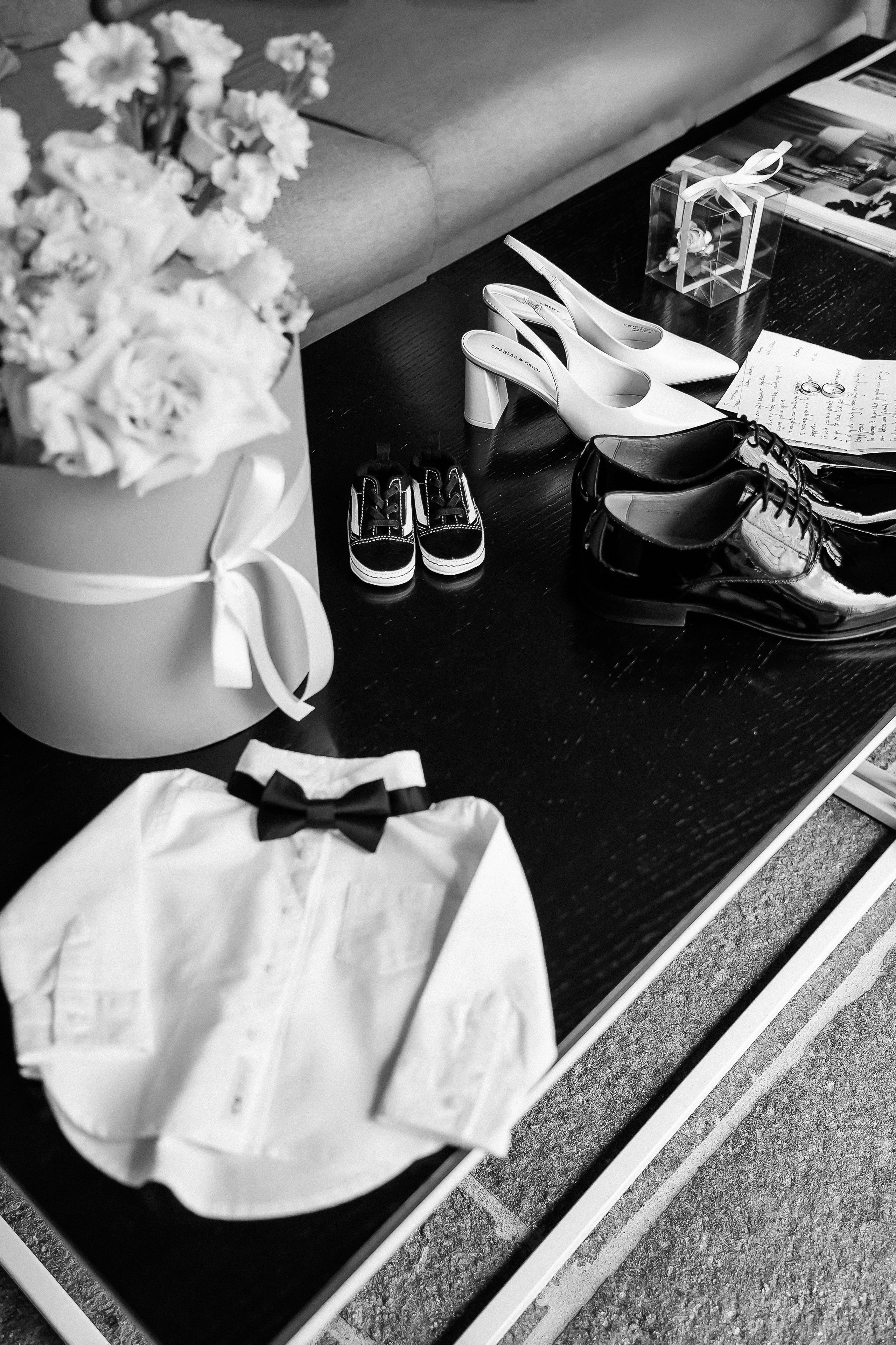 Wedding day details flat lay with flowers, shoes and champagne at a Lake Como villa, Italy