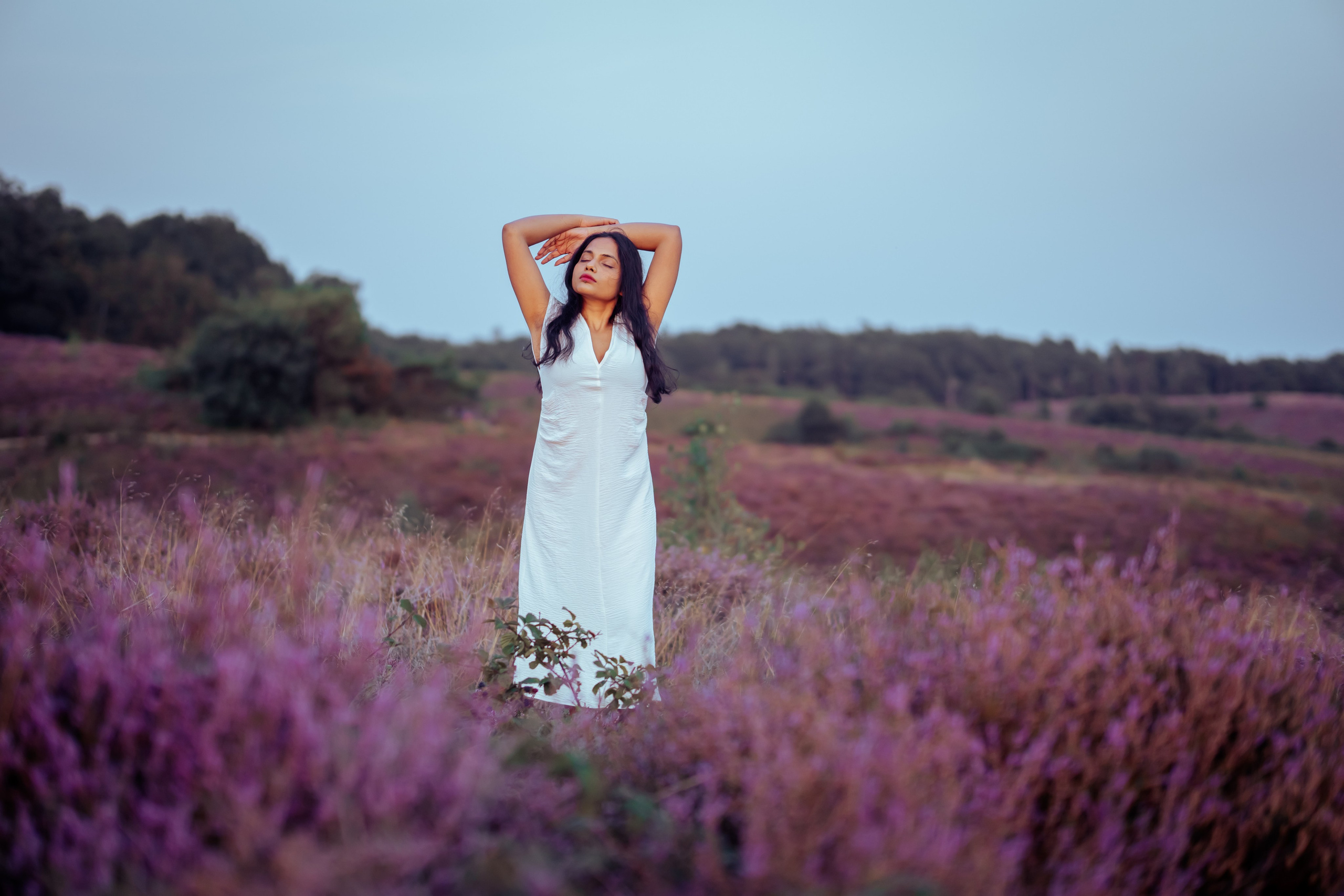 woman standing in veluwe heather fields netherlands