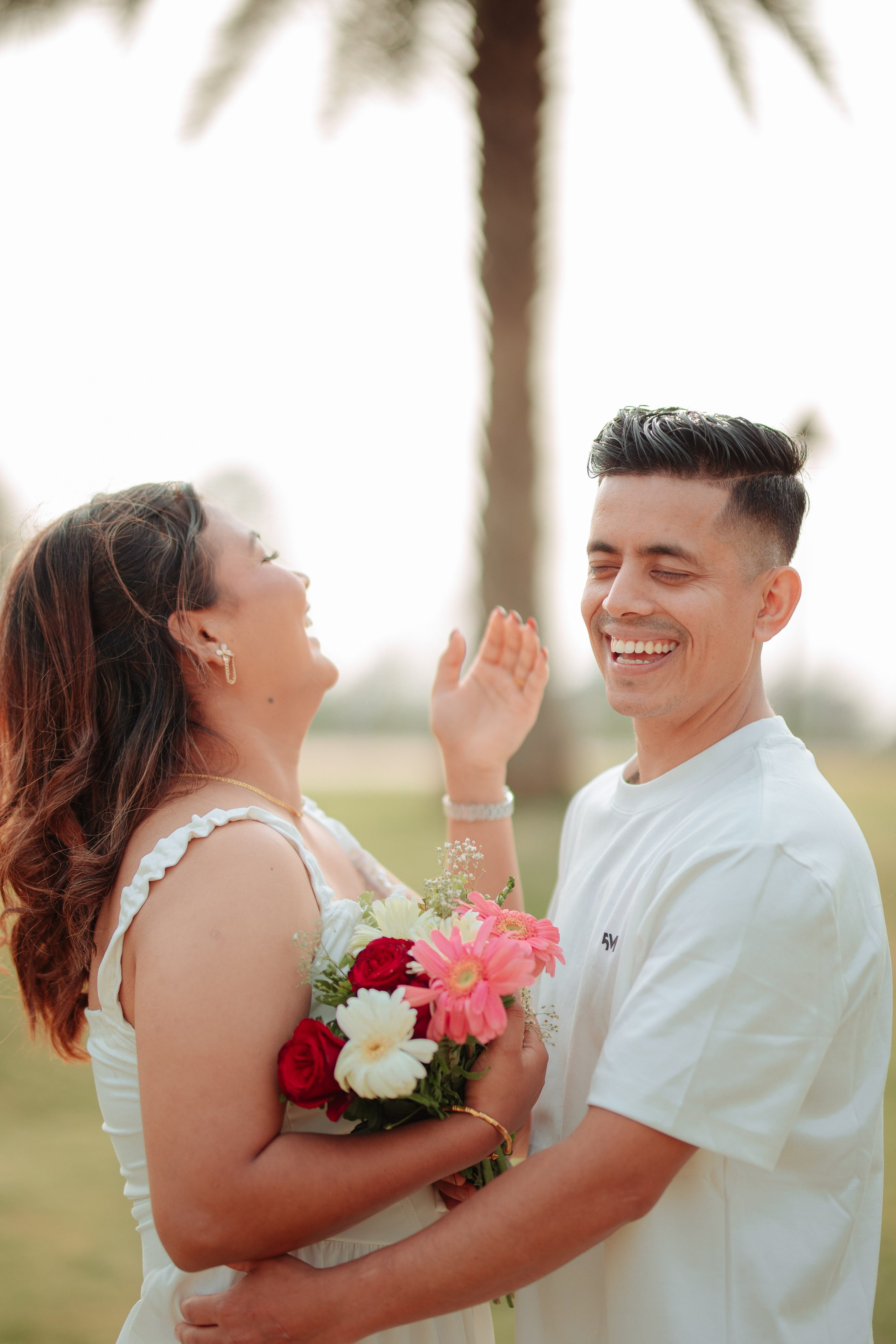 Groom surprising the bride with flowers during pre-wedding shoot in Butwal
