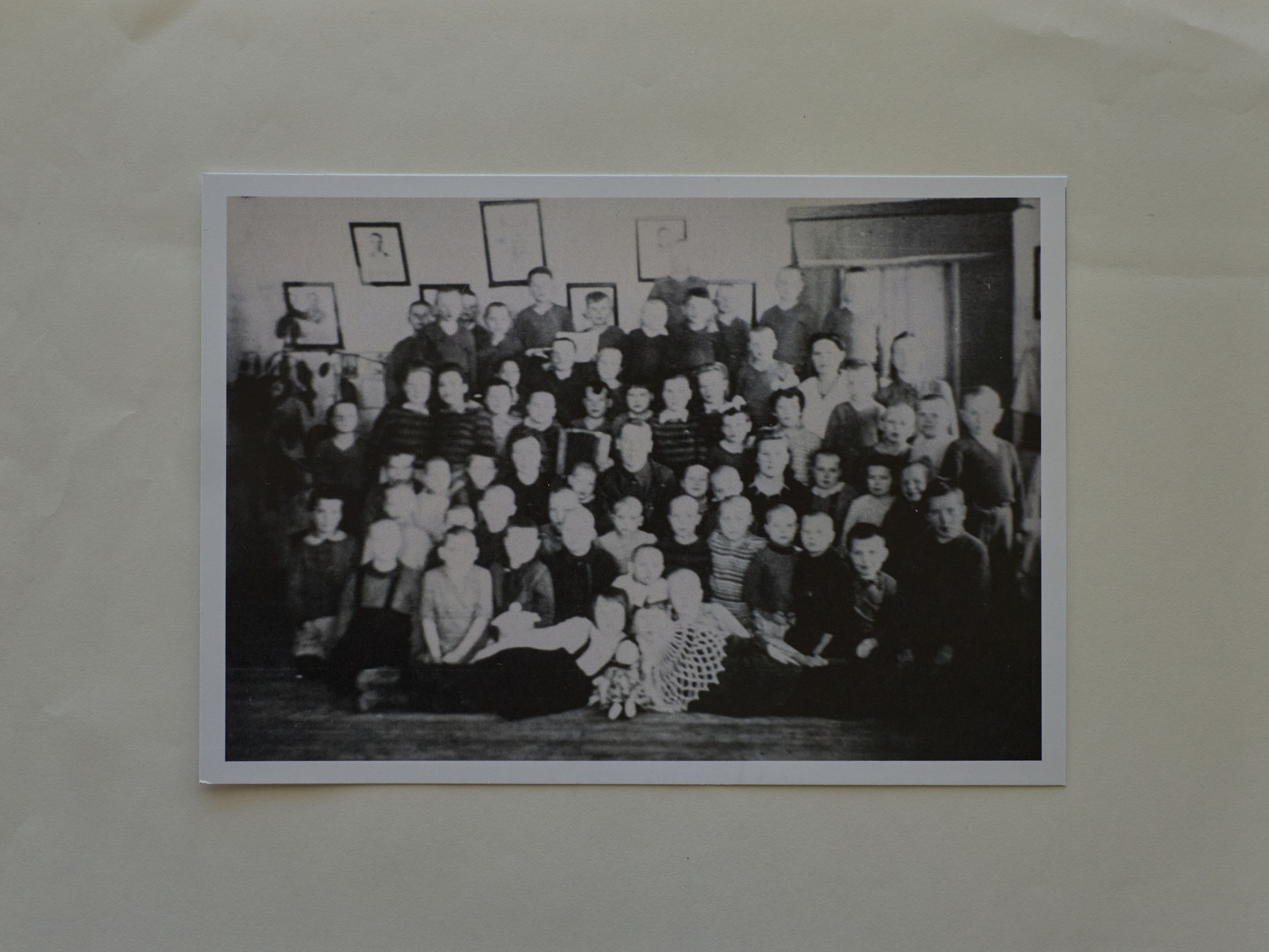 Yuhanya's only childhood photo is a blurred one. He can't find himself in it, but he knows he's there.