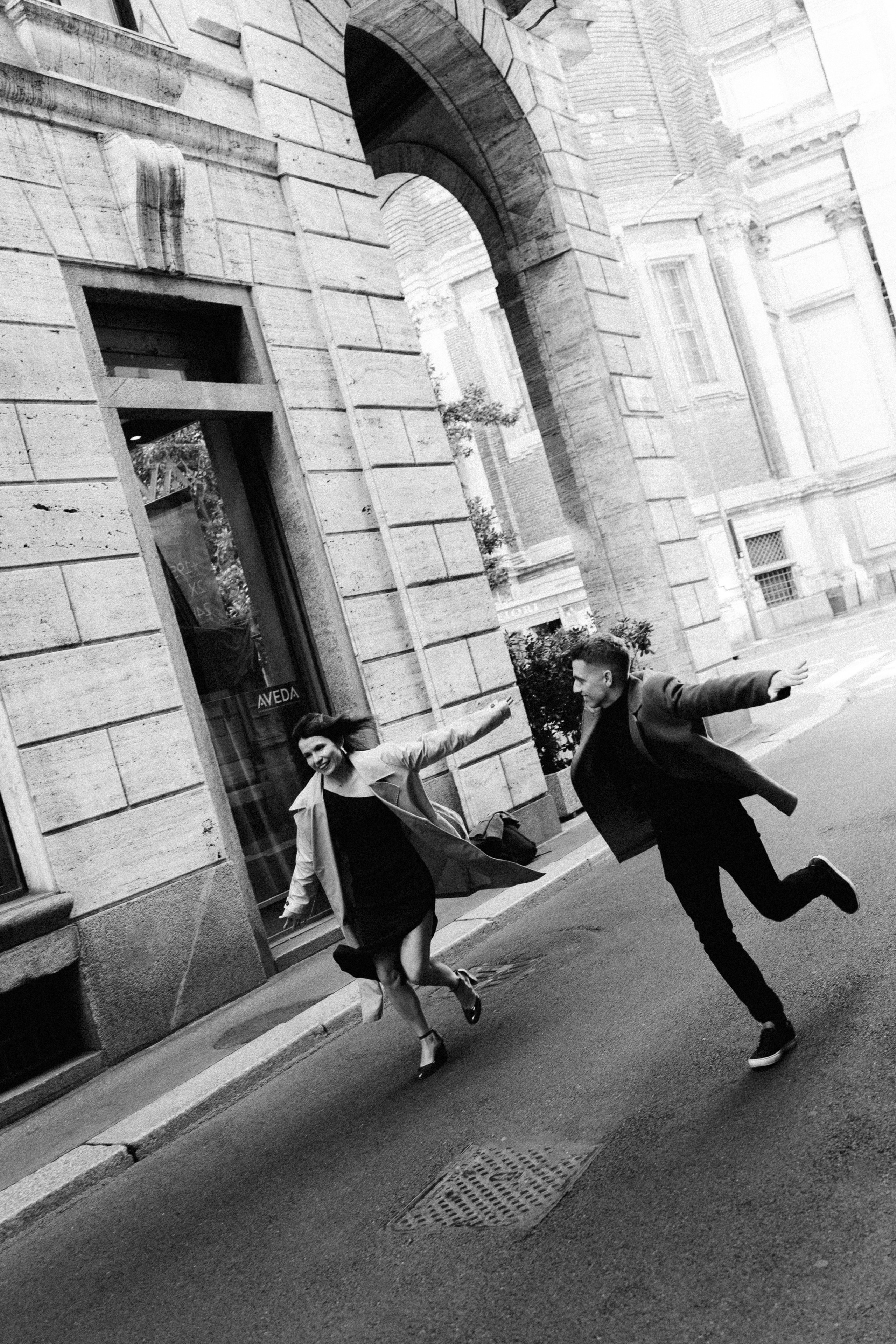 Motion-filled photo of the couple spinning and laughing