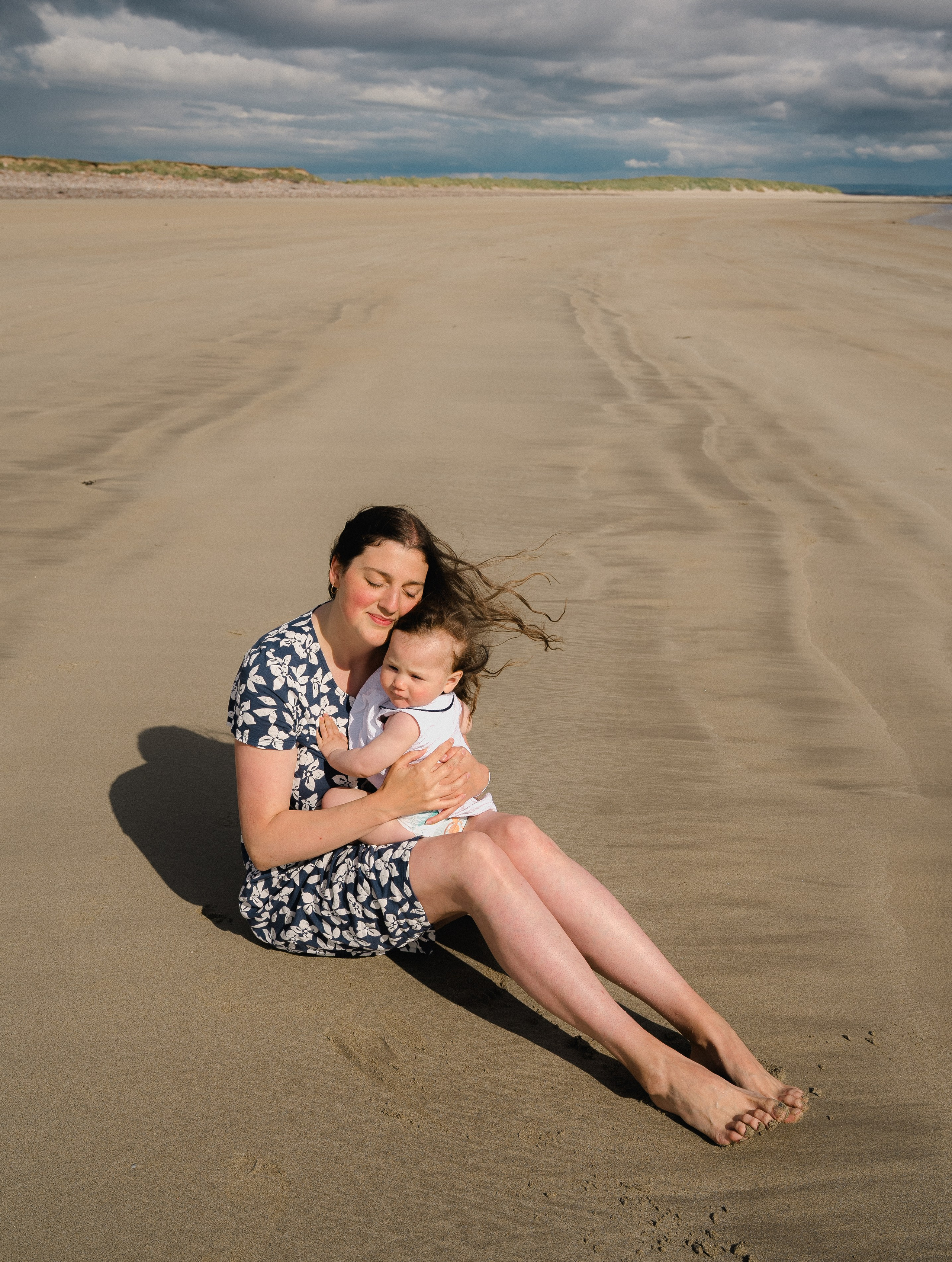 Darya and Mia at the ocean. Wedding and family photographer Ireland