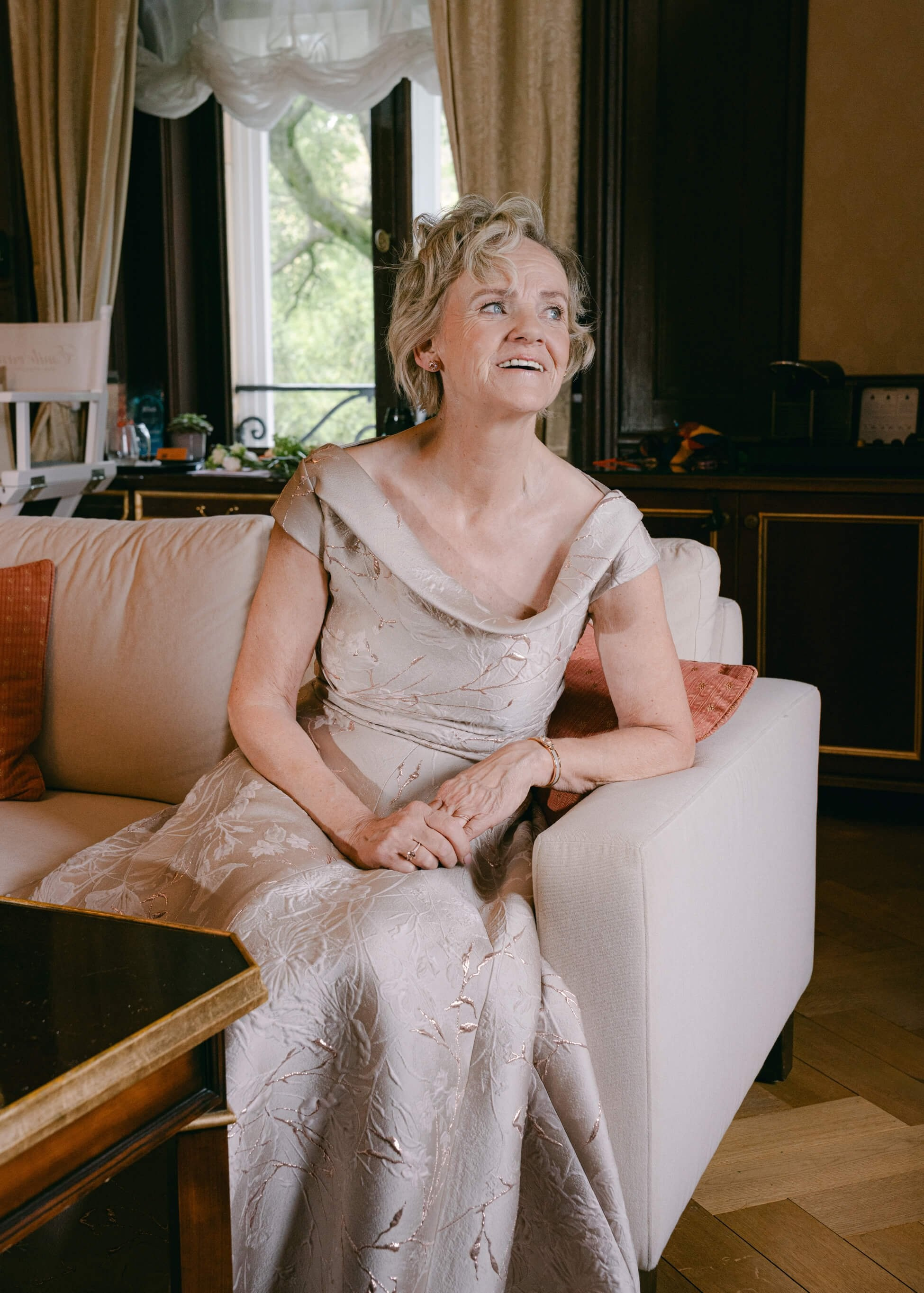 Female wedding guest in elegant champagne dress, getting ready at Villa Rothschild Frankfurt luxury wedding