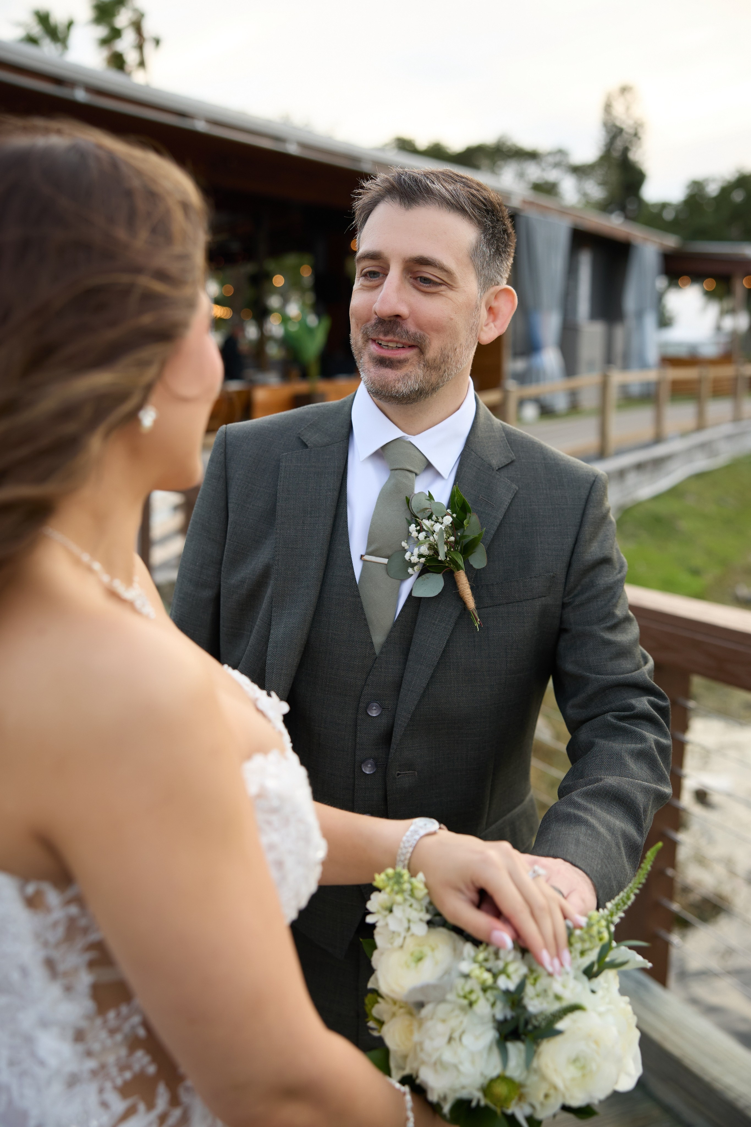 Groom seeing his bride for the first time before the ceremony