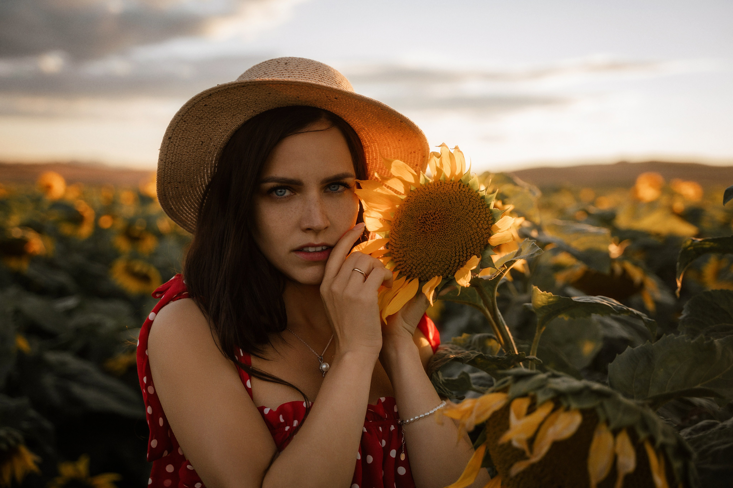 Elegant sunset portrait in sunflower field, captured by Marbella portrait photographer