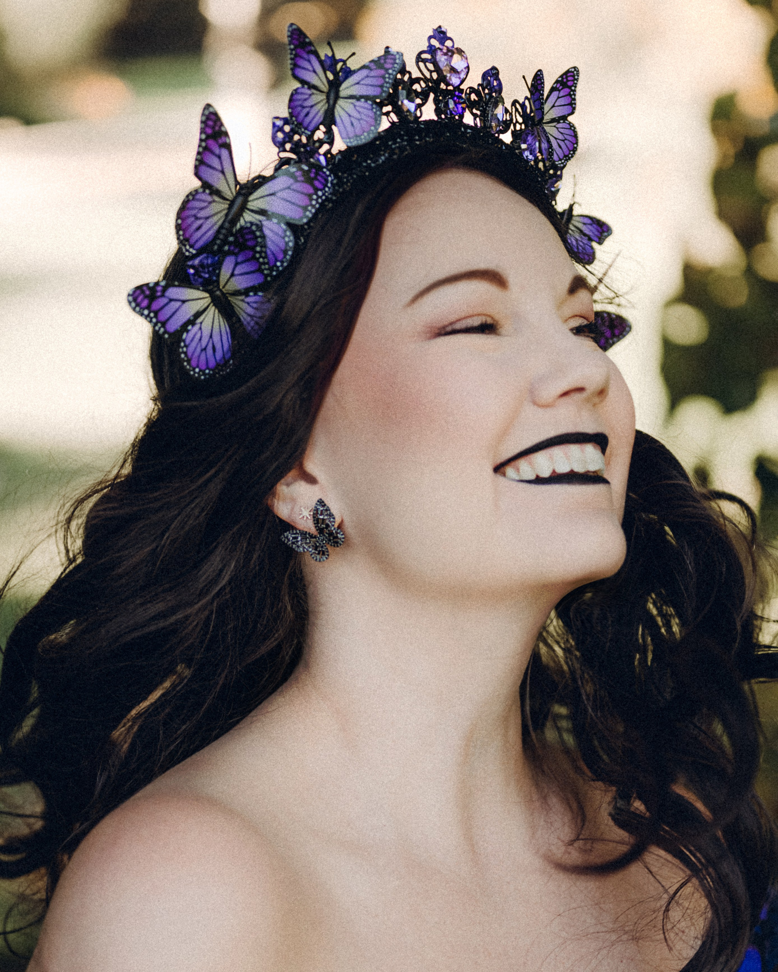 Butterfly purple fairy in a blooming garden. Moth & Moss Photography