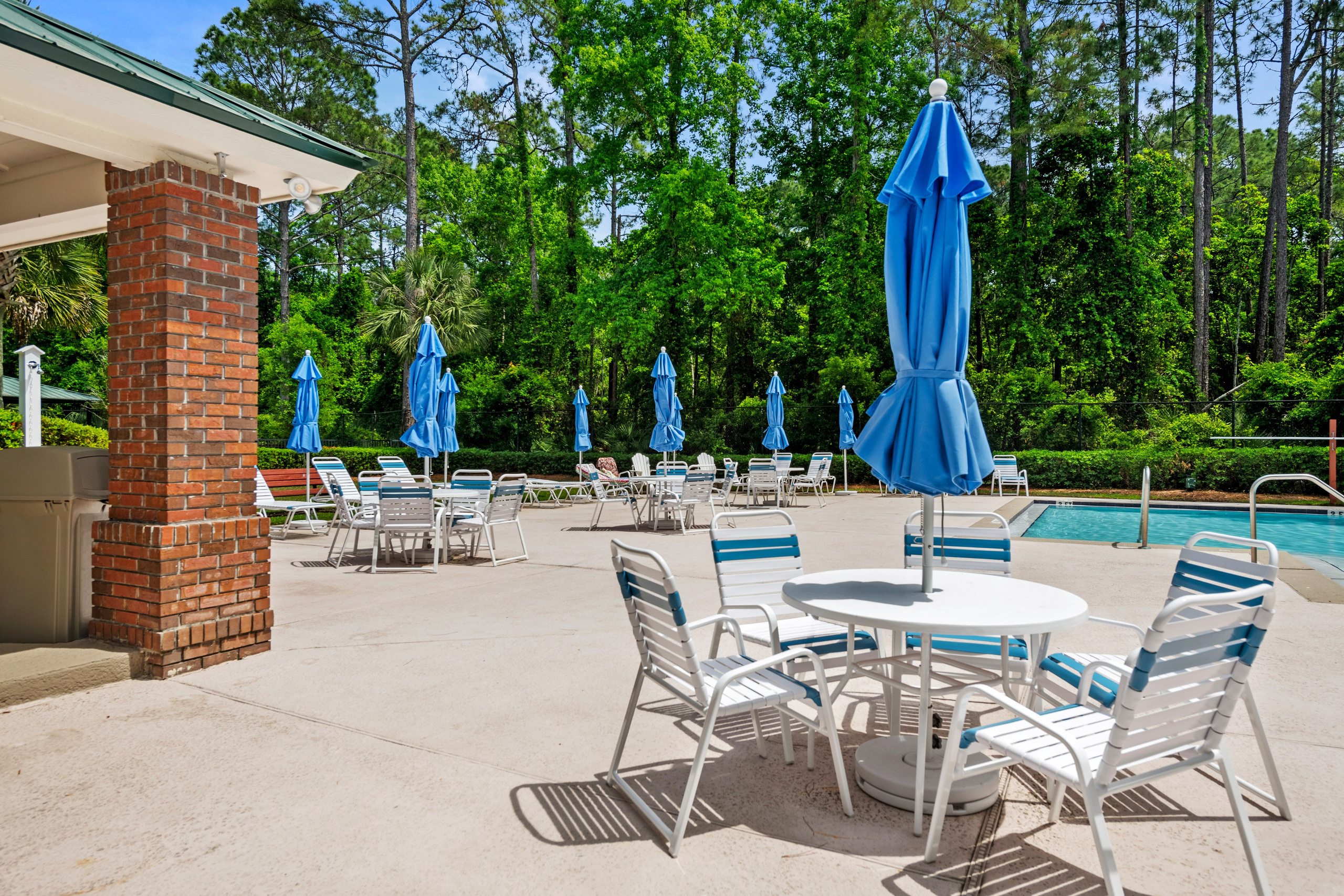 Community pool with relaxing shaded lounge area