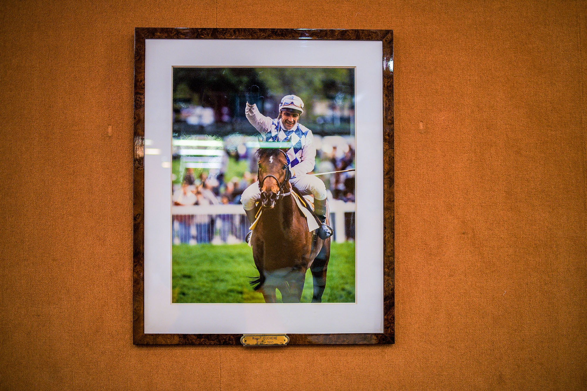 Historic jockey portrait displayed at Hippodrome d’Auteuil in Paris