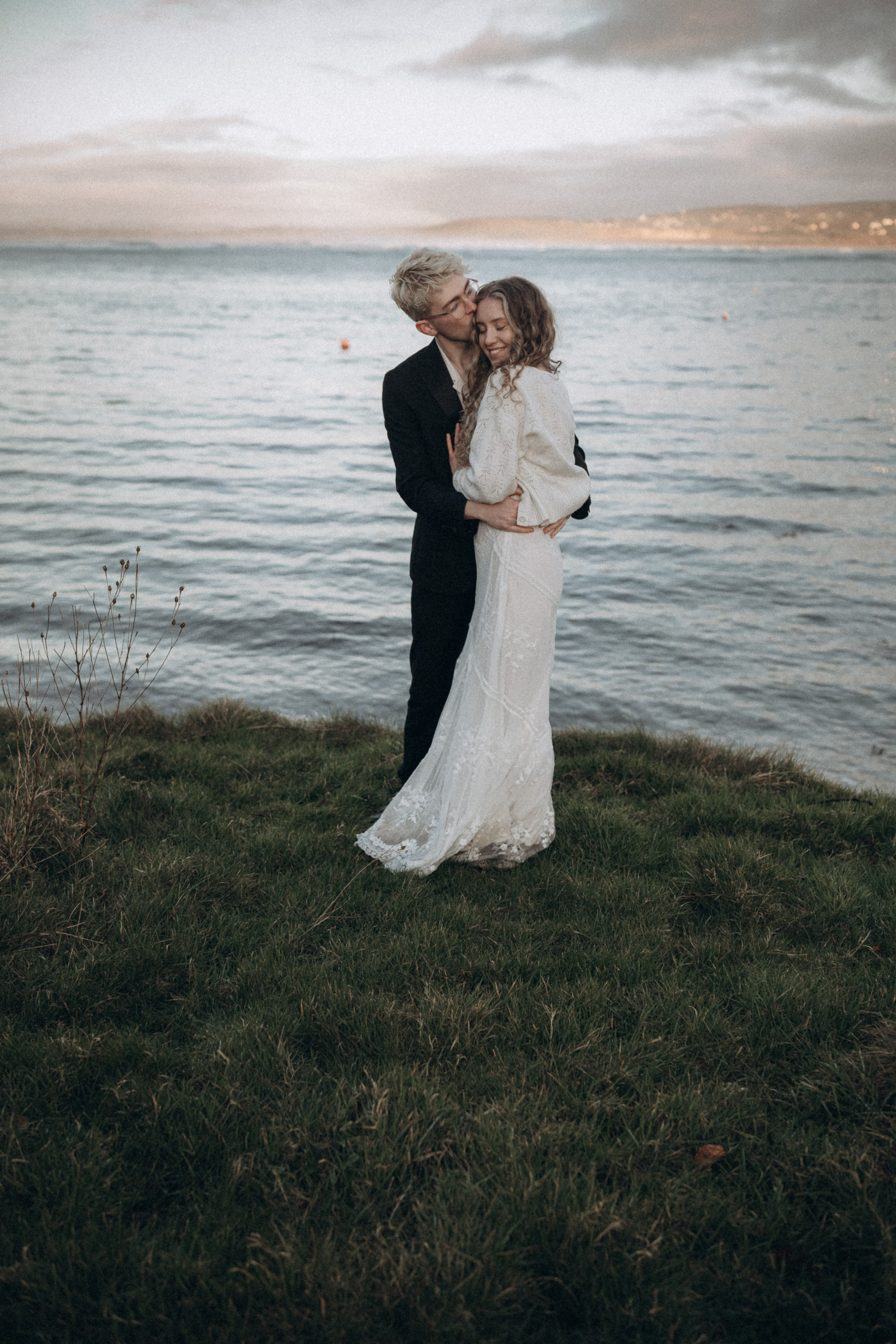 engaged couple by the lake