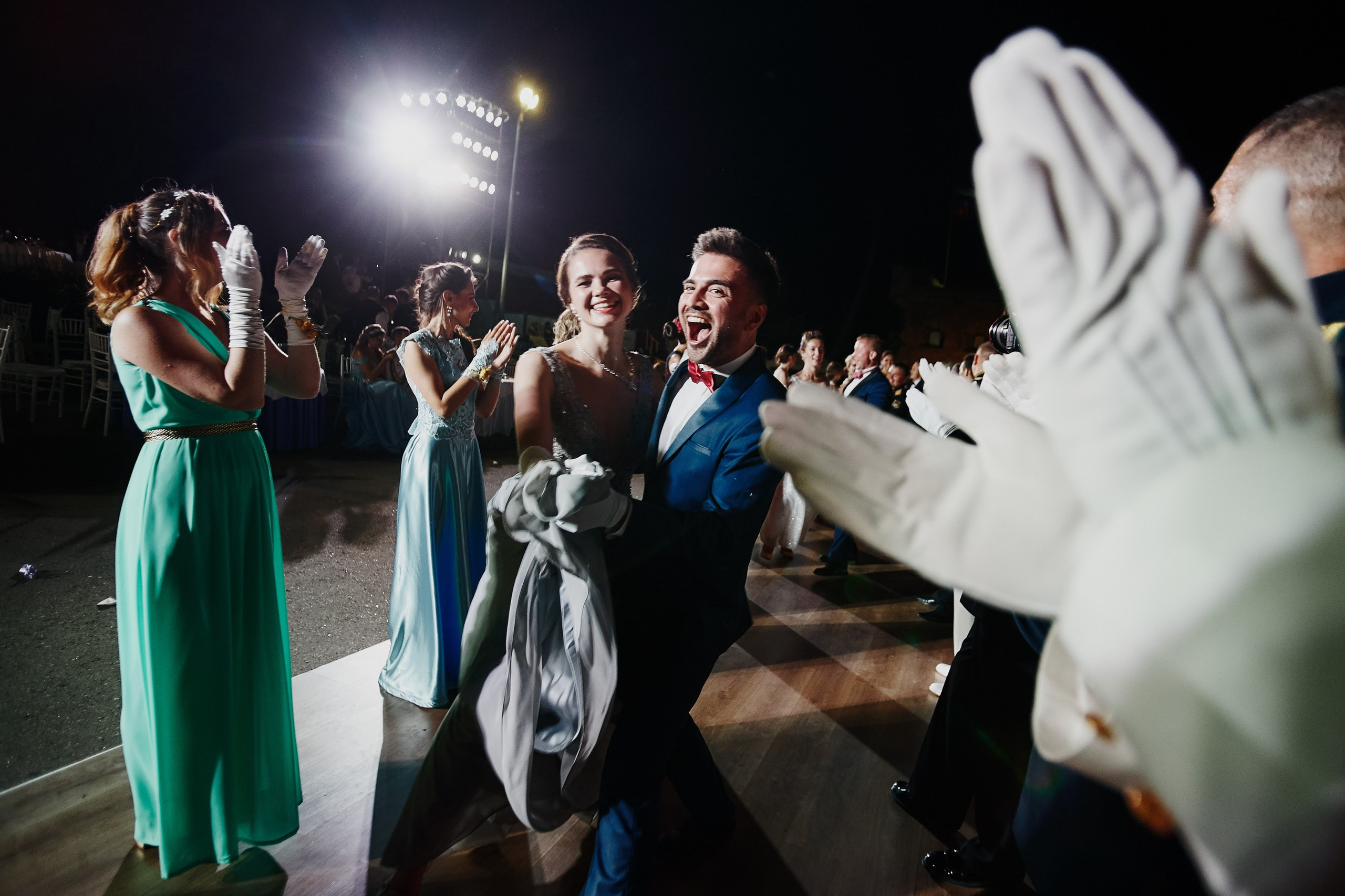 Group of people laughing and talking at outdoor event