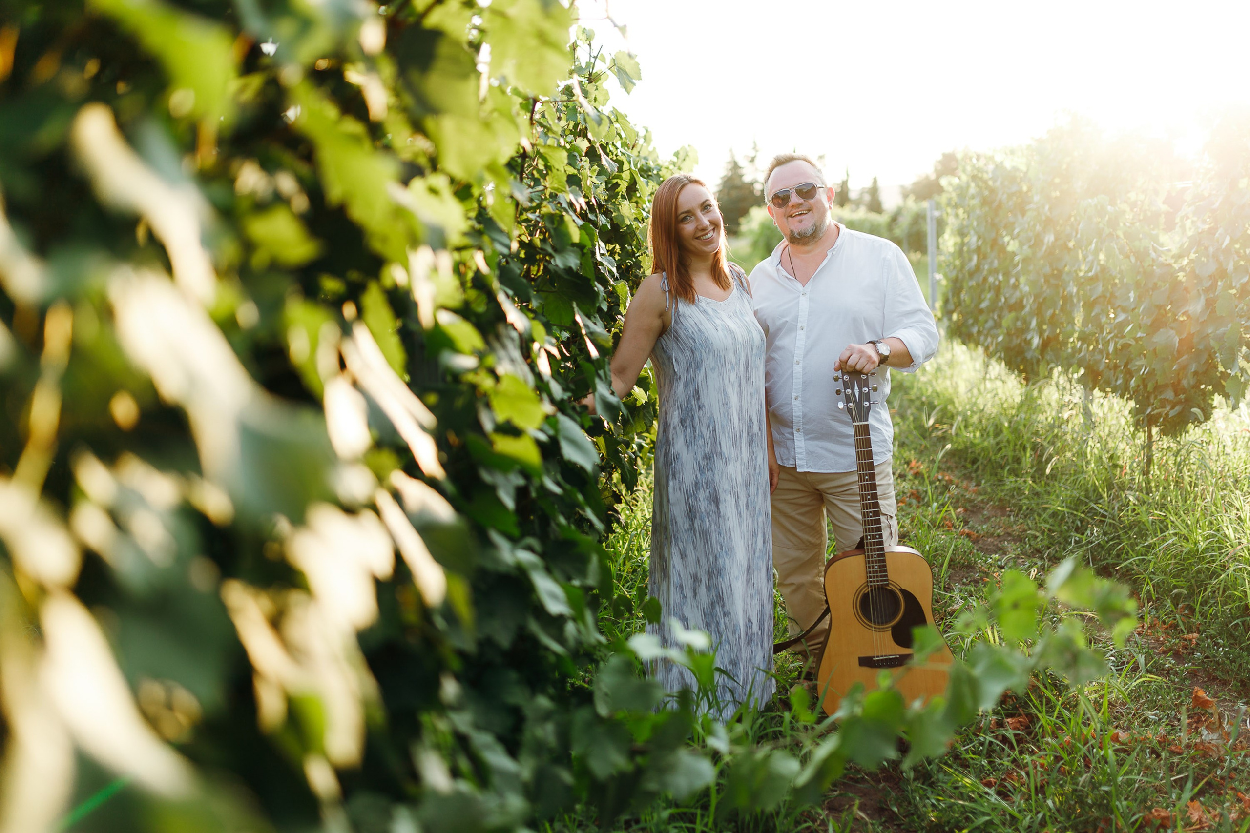 Couple walking in vineyard, romantic outdoor session
