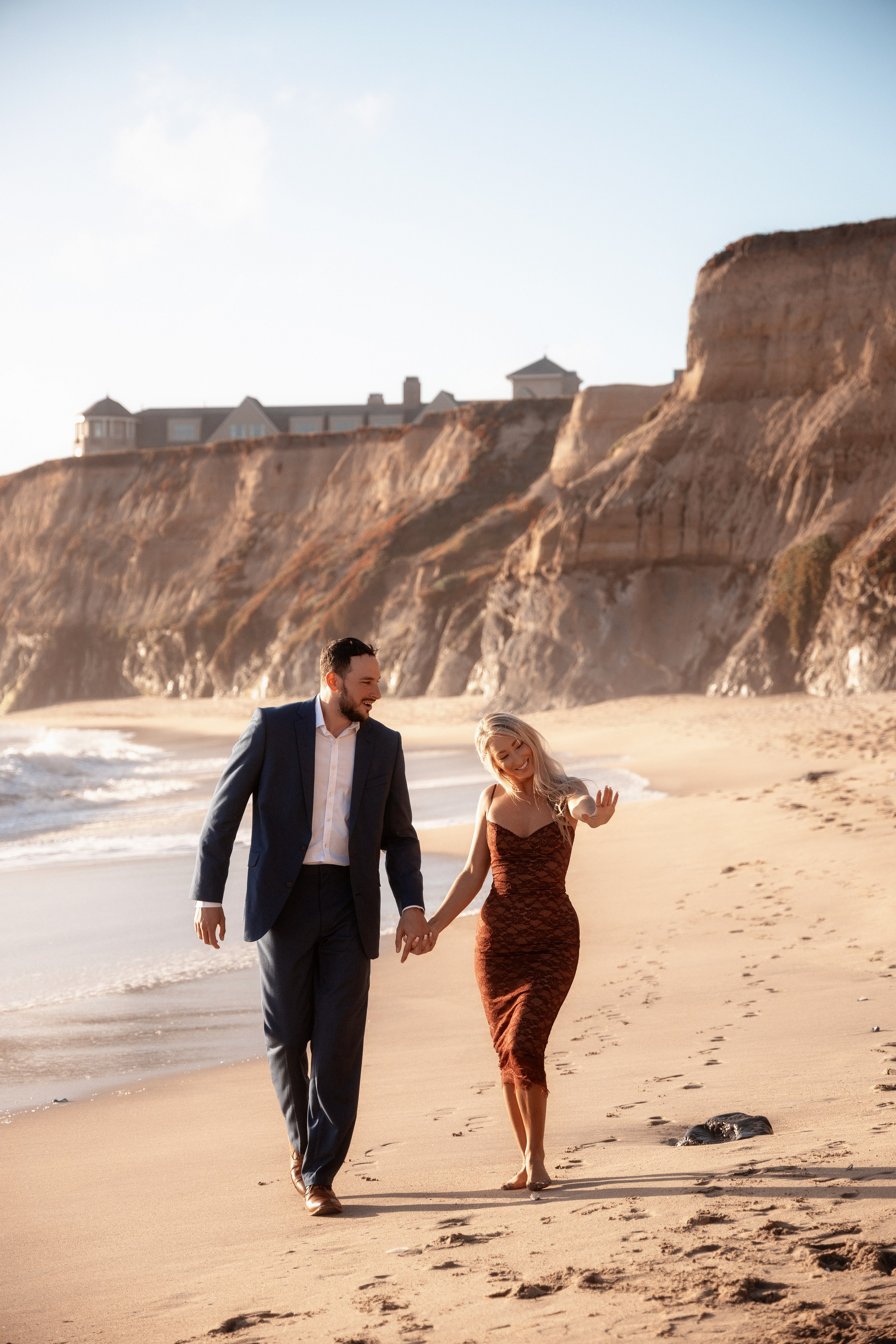 Groom and bride smiling with a panoramic view of the Bay Area