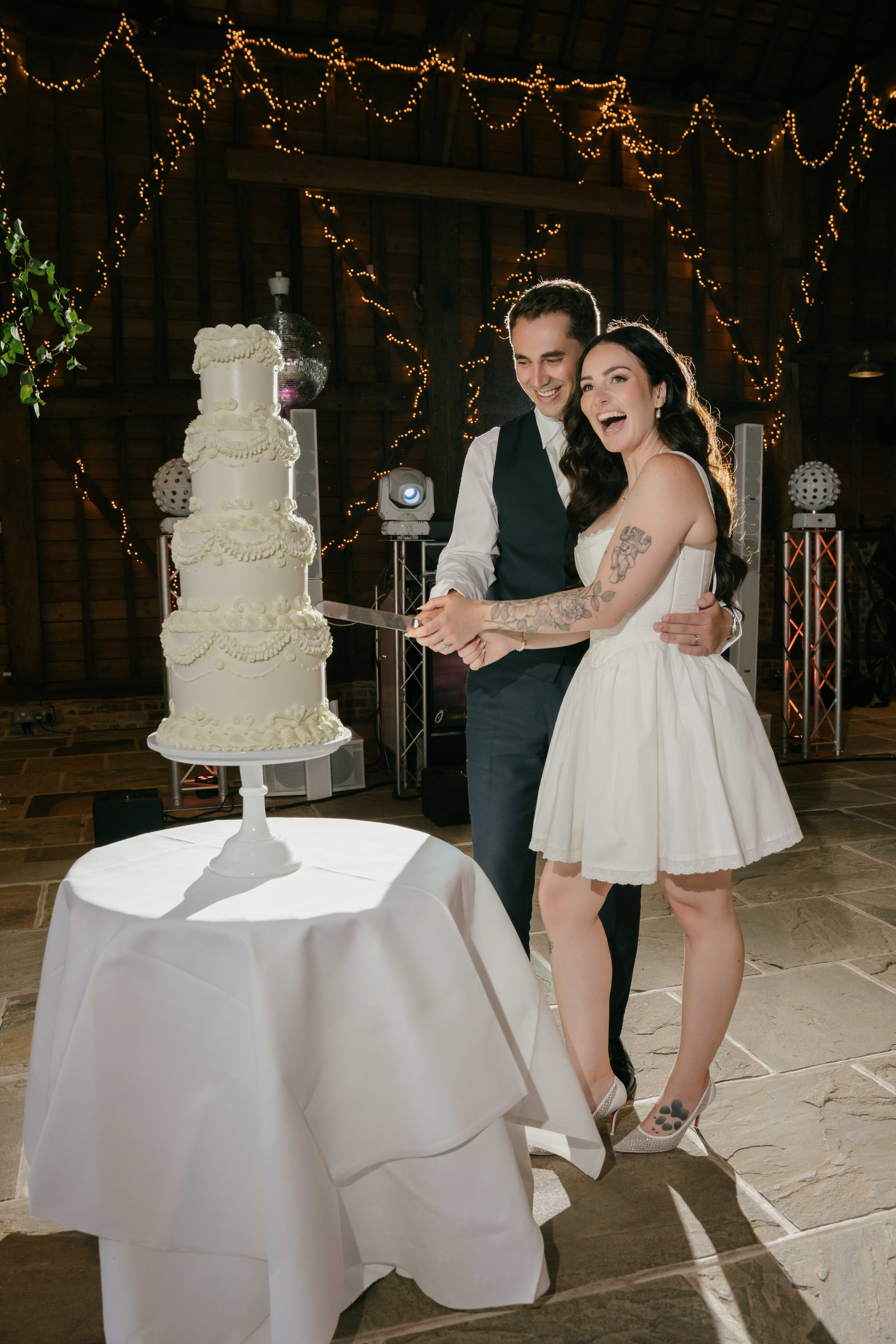     wedding cake cutting Layer Marney Tower evening reception