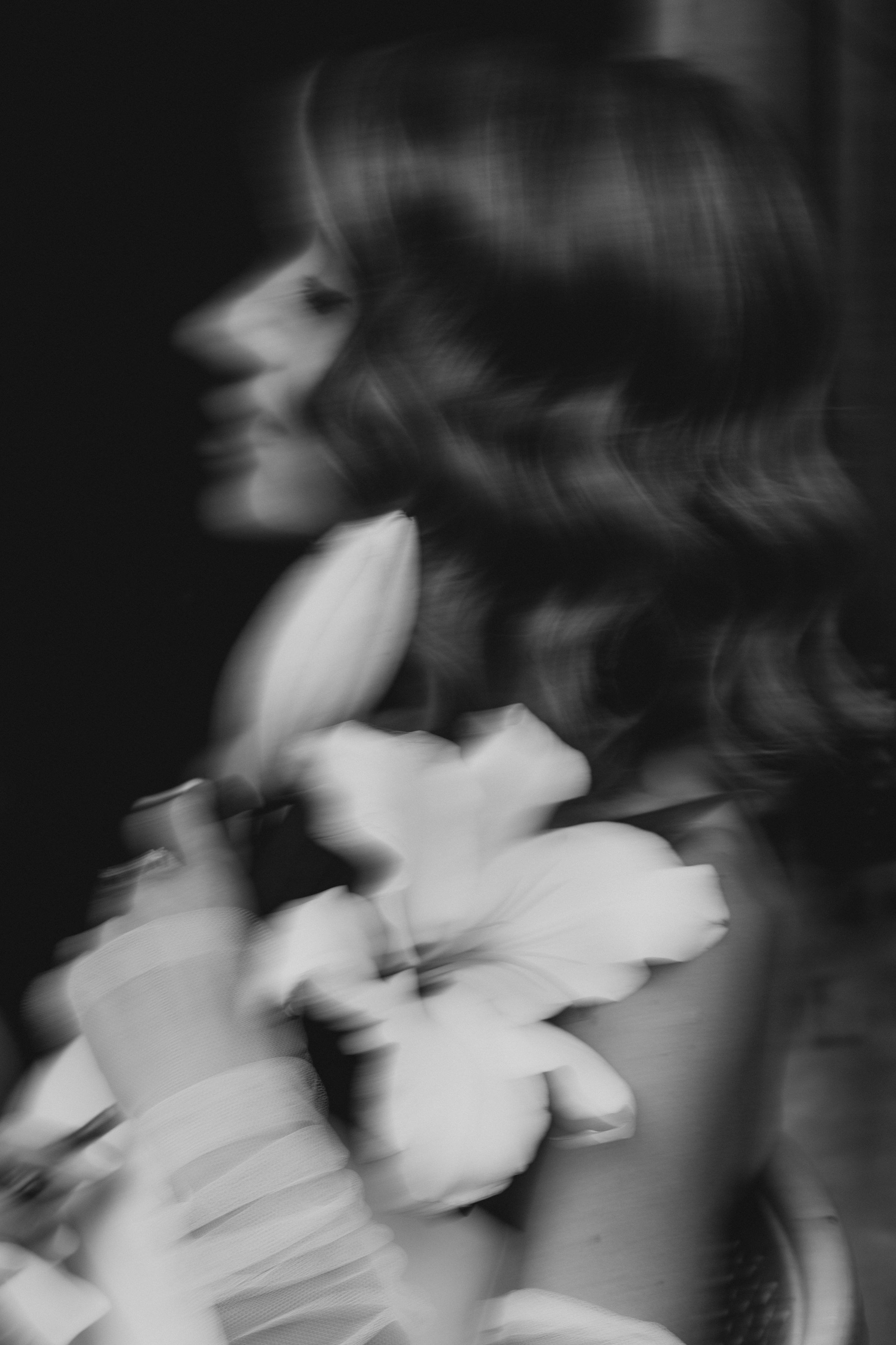 Paris wedding photographer capturing an artistic bridal portrait, luxury black and white wedding photography in Paris