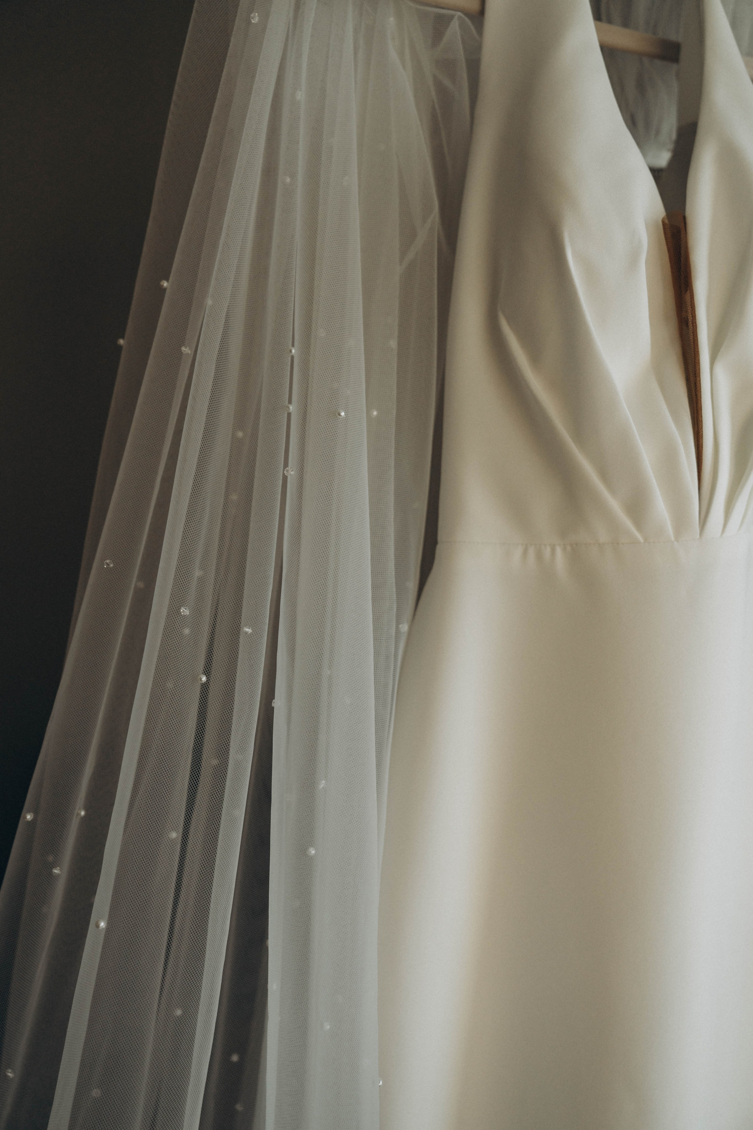Bridal bouquet detail near historic Amsterdam church steps.