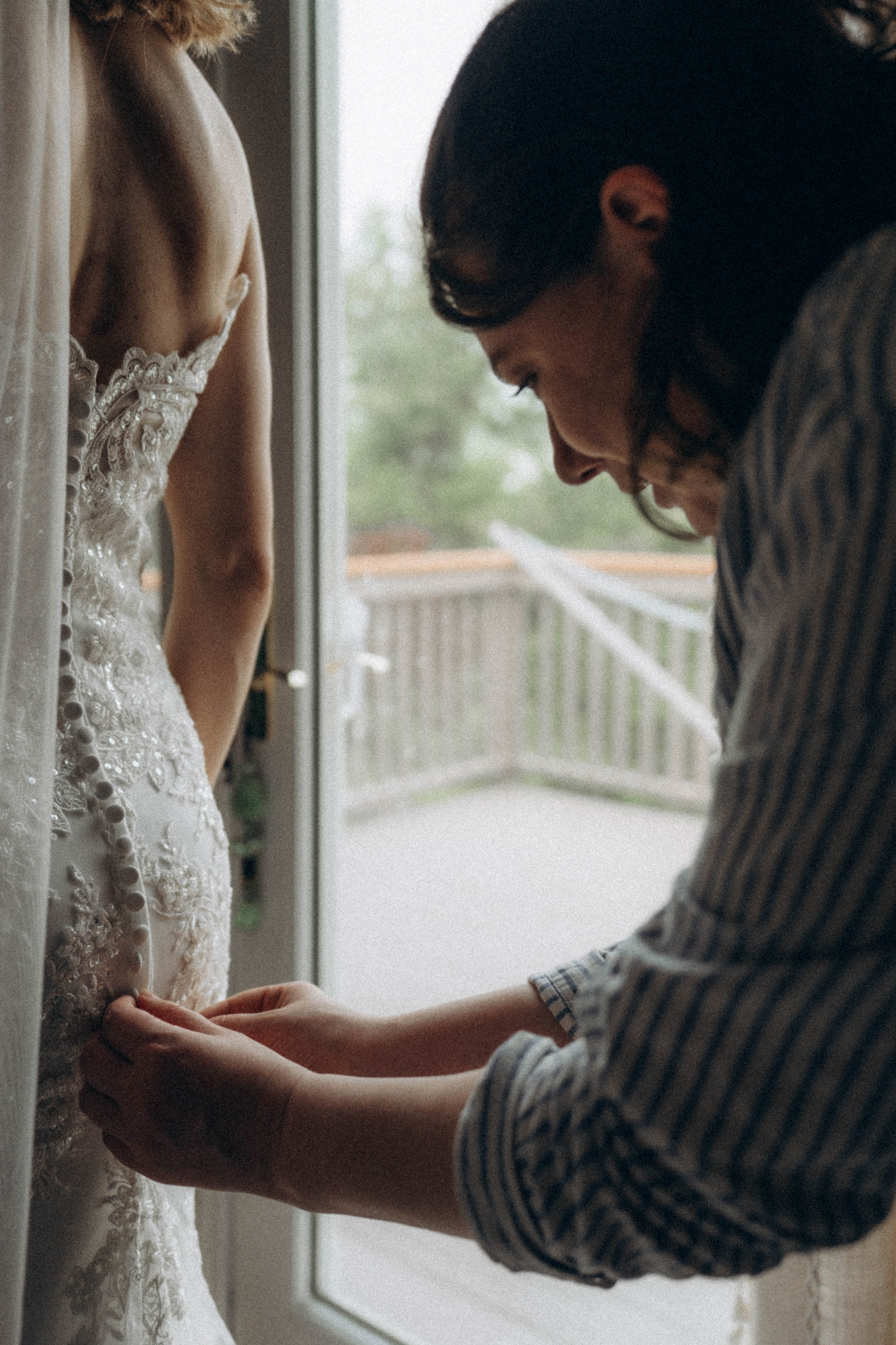 Bride sitting on rustic bench in Hudson Valley.