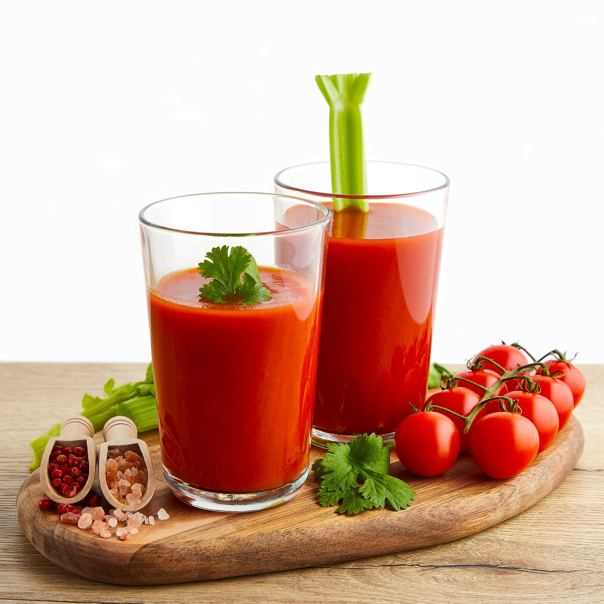 Photographer Roman Djuzev - Photo of tomato juice in glass glasses on a wooden board.