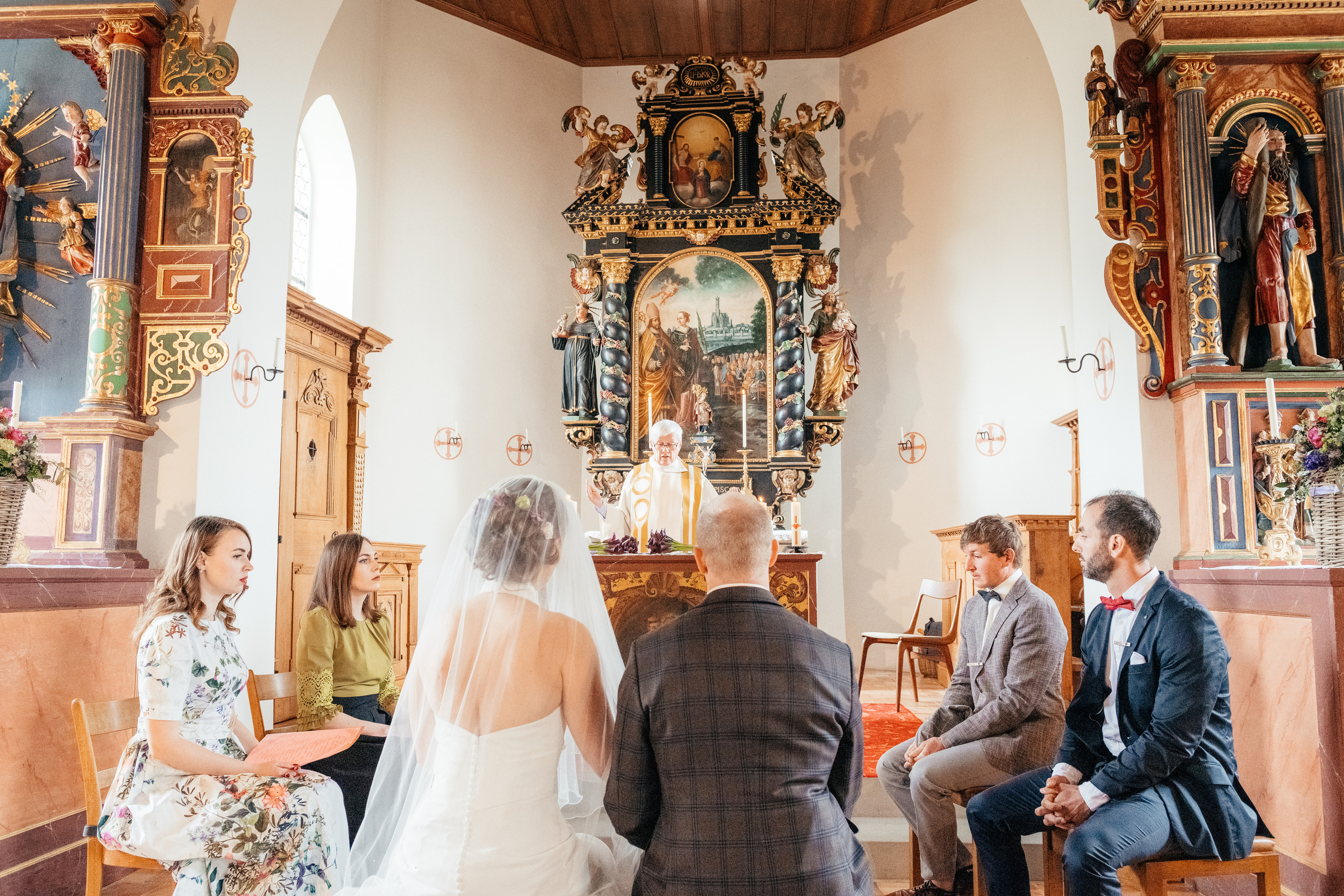 A wedding couple in a church at wedding ceremony