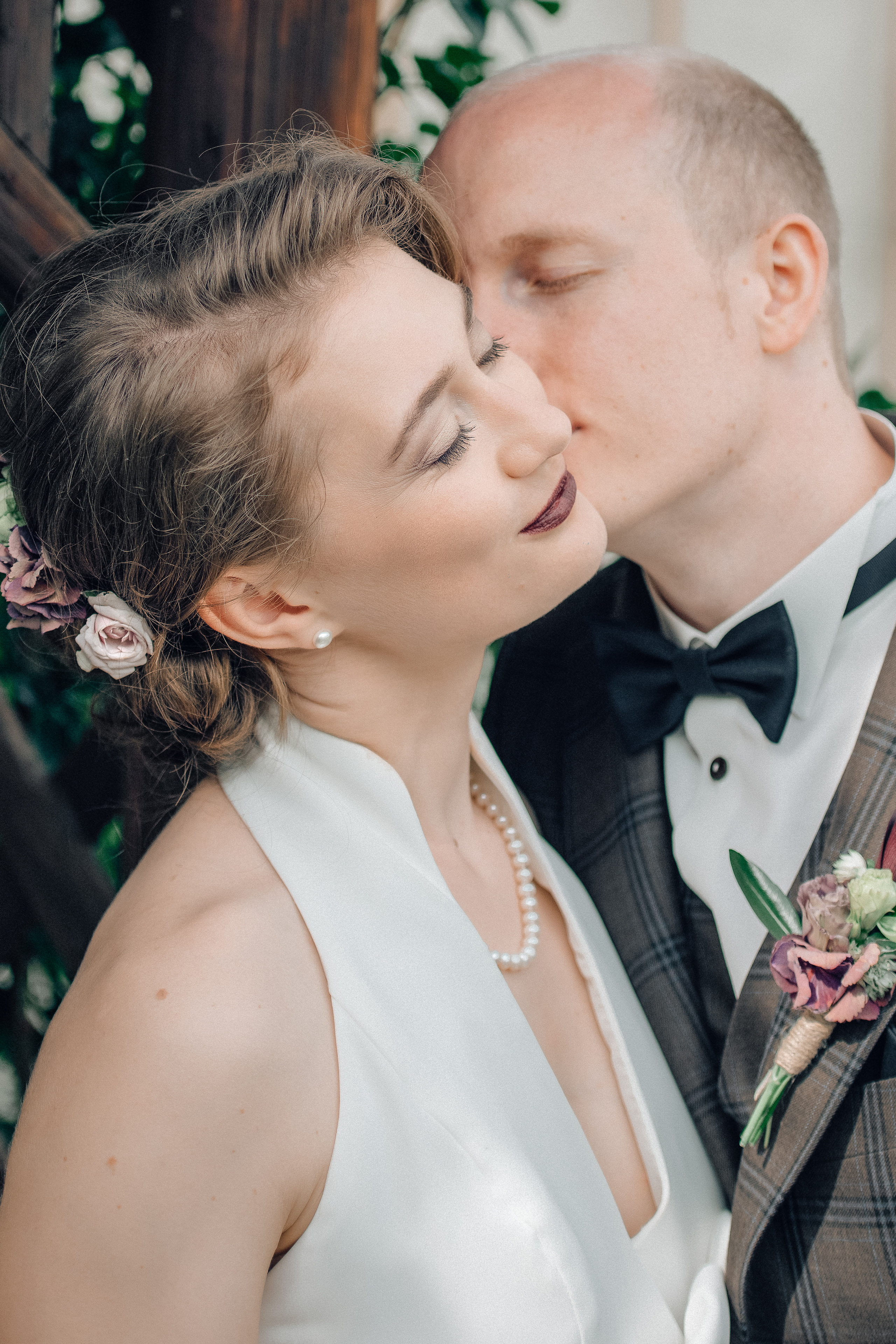 A groom kisses his bride