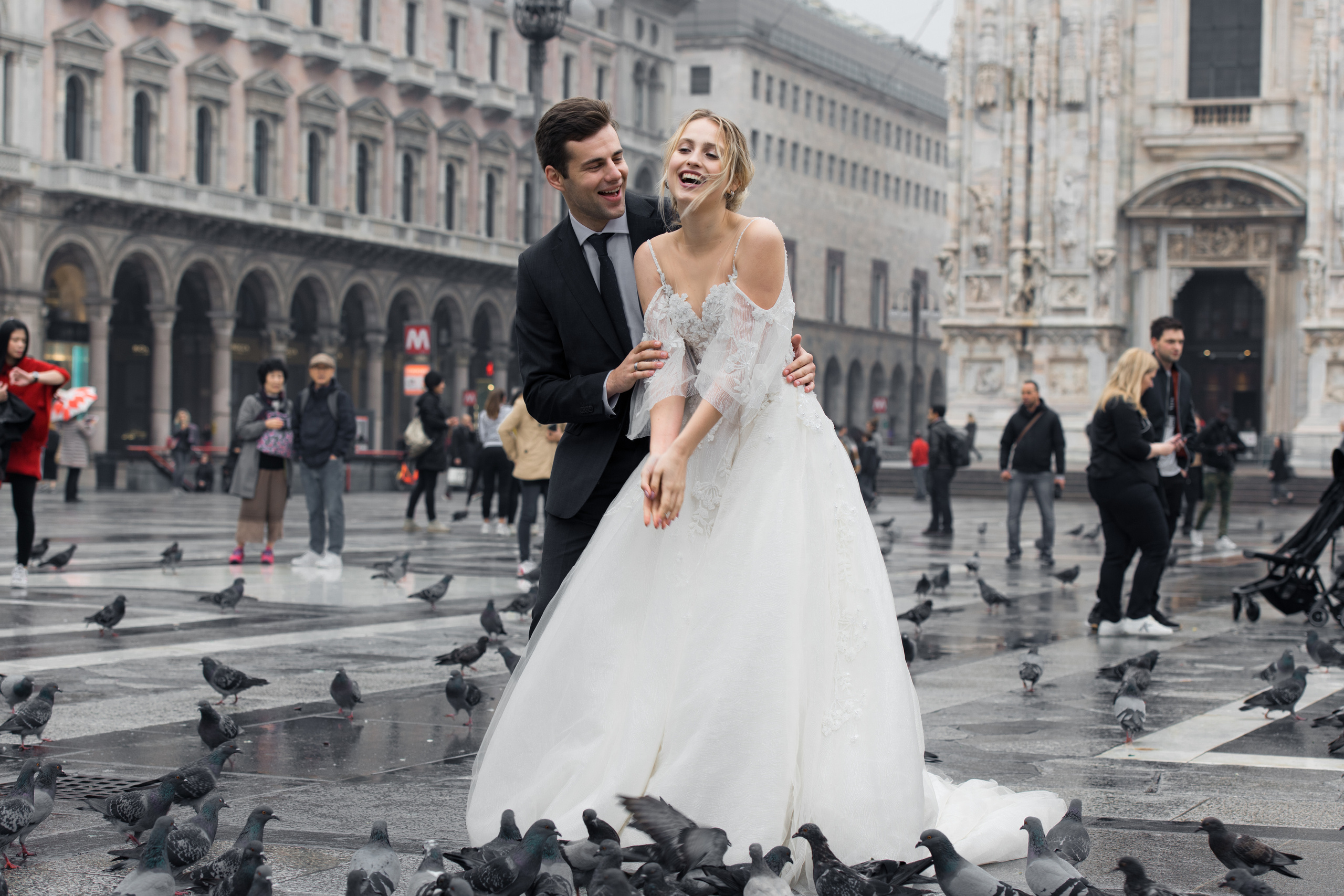 A beautiful wedding couple in Milan, Italy near Milan Cathedral with flying doves. Milano Duomo wedding