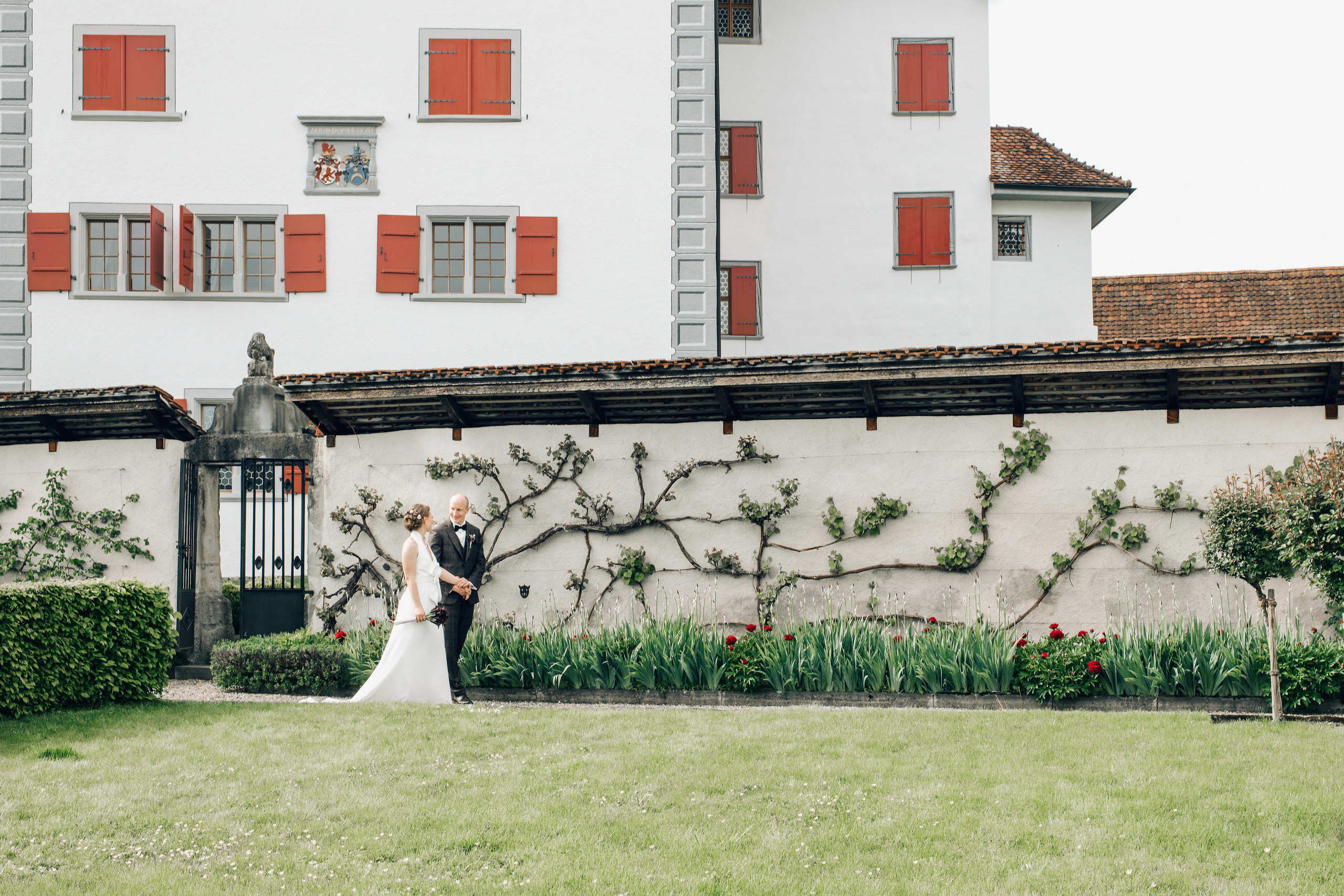 A wedding couple near the castle in Switzerland