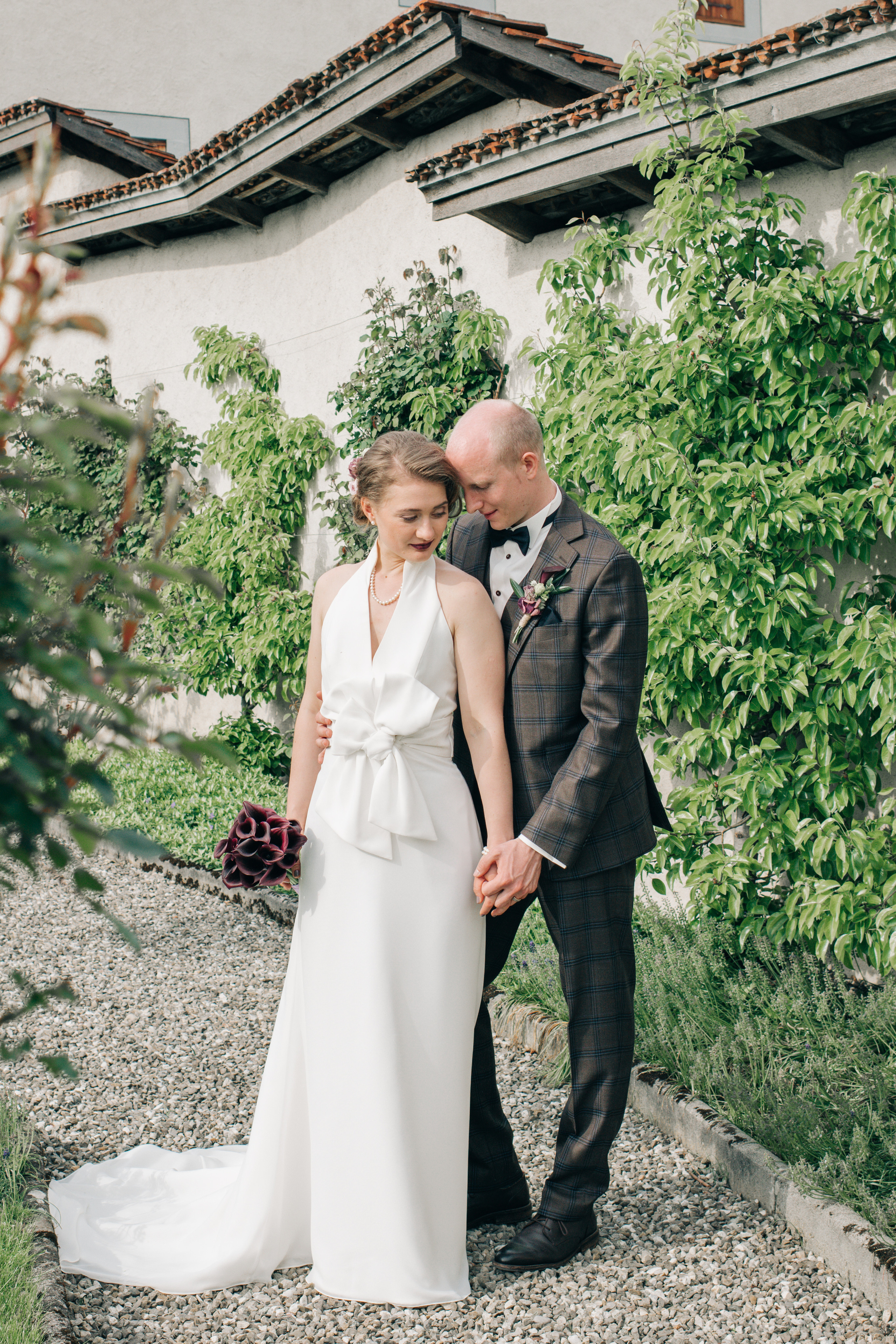 A wedding couple hugs each other