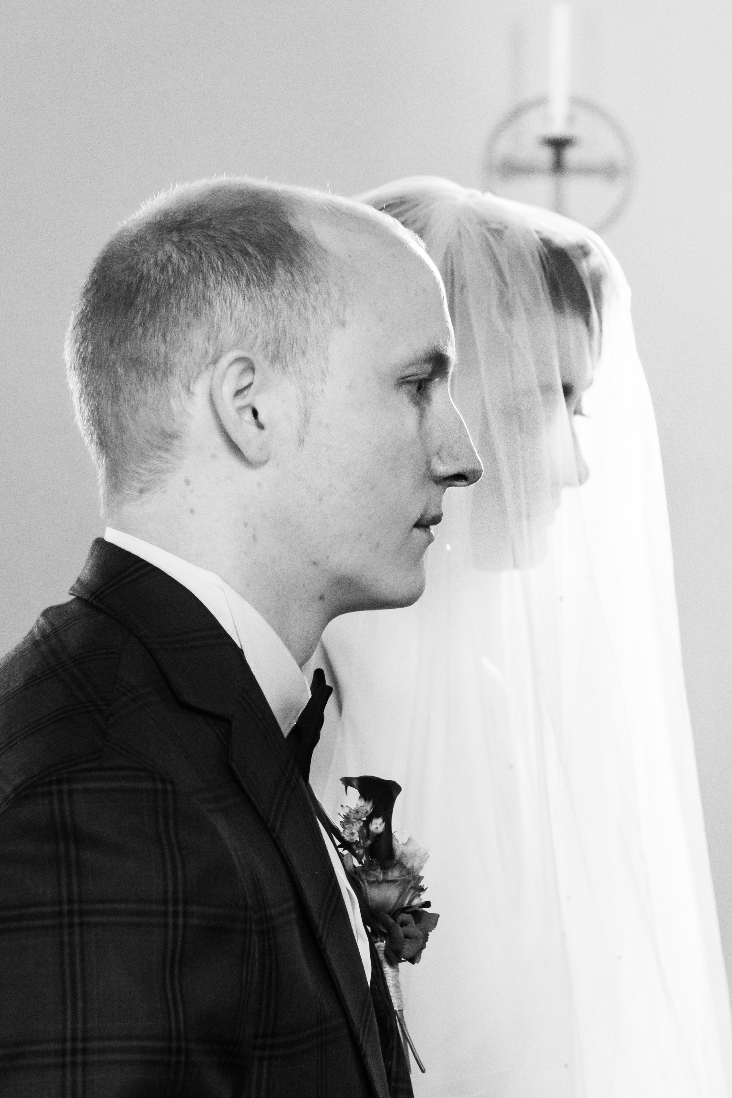 A wedding couple in a church at wedding ceremony