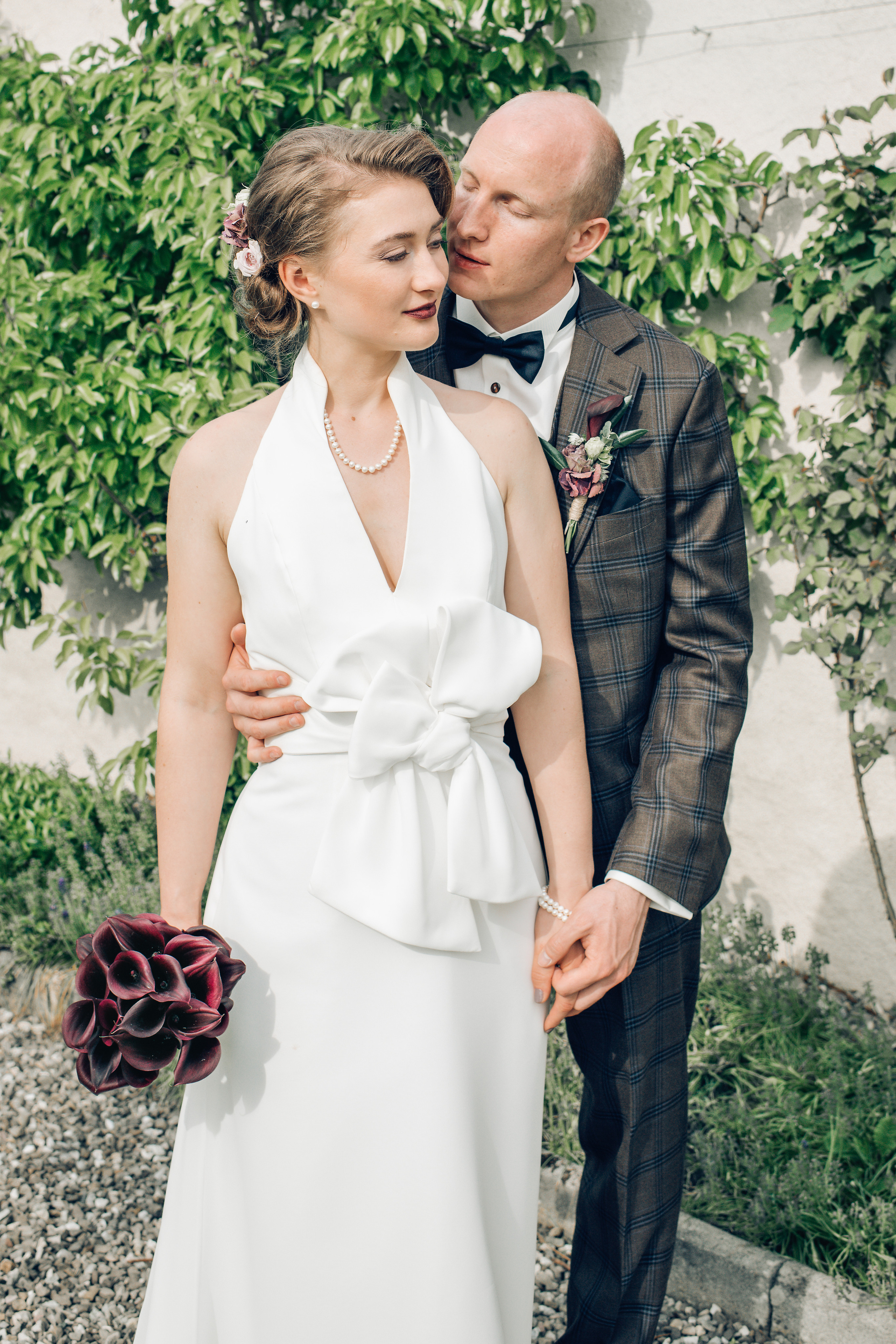 A bride in a wedding dress with a bouquet of flowers